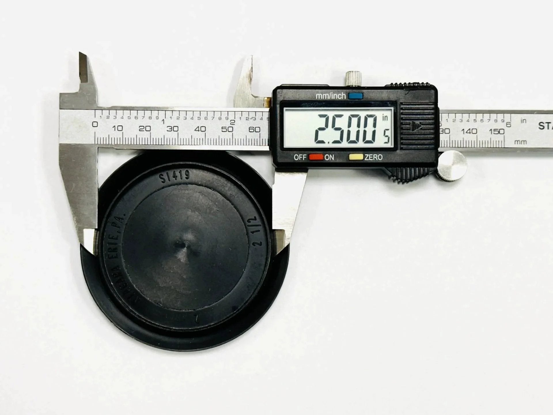Caliper measuring Hole Size Two And A Half Inch Flush Mount Hole Plug In Black Plastic Body For Sheet Metal With A Three Inch Head Diameter