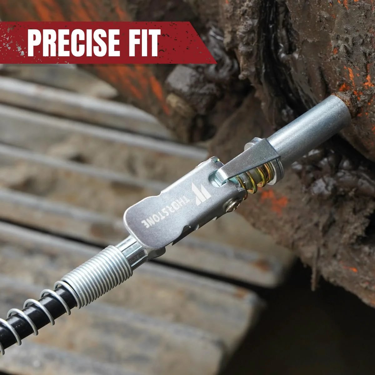 Close-up of the Beefy 7000 PSI Pistol Grip Grease Gun Kit with lock coupler in use on machinery, Thorstone branding visible.
