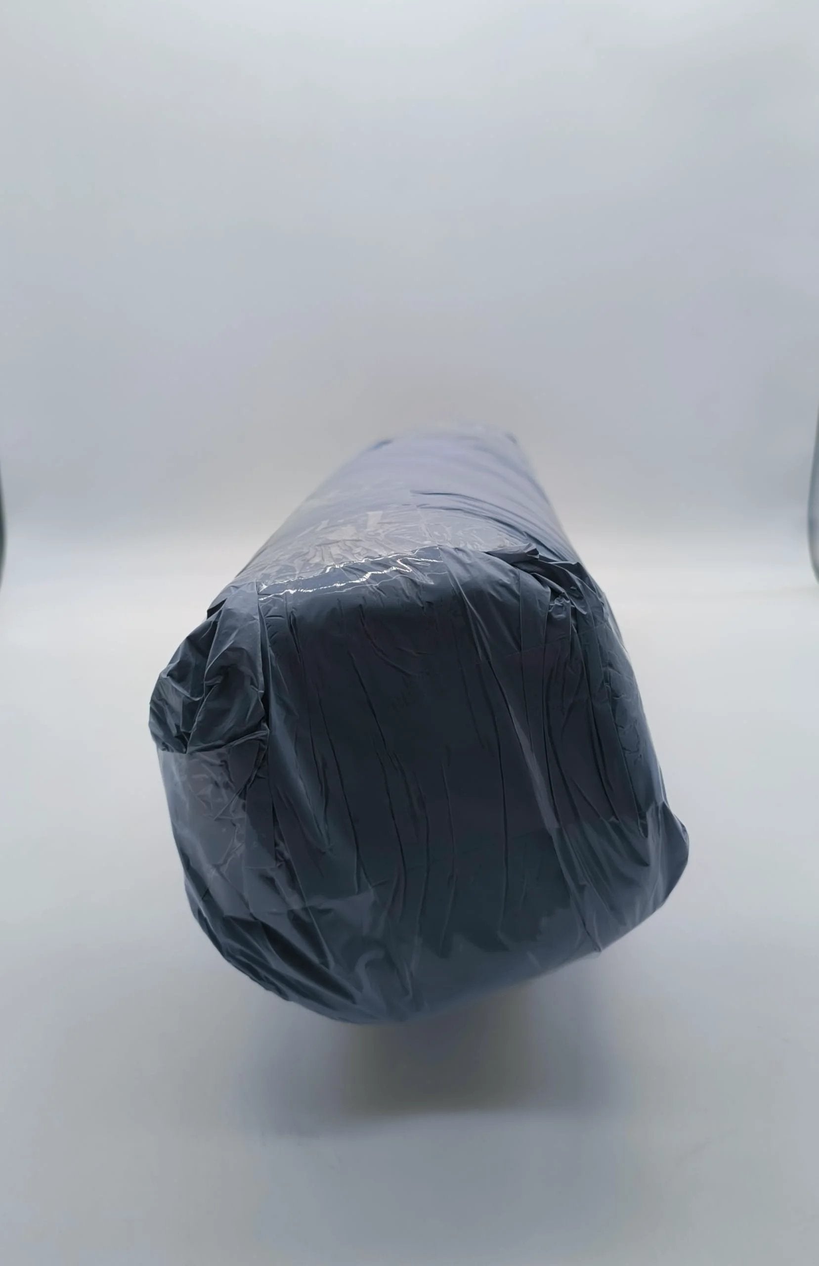 Ceramic Fiber Blanket Insulation Mat With Single Sided Aluminum Foil Facing 2300F Heat Shield in packaging, rolled end view