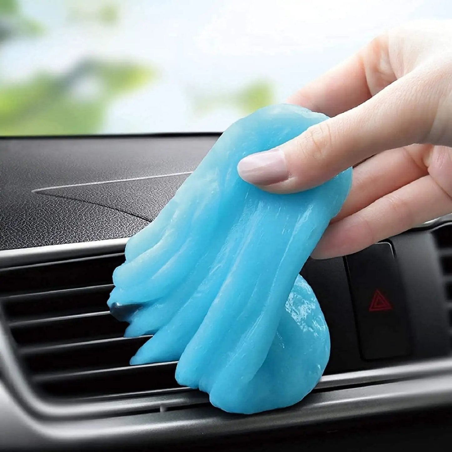 Cleaning Gel For Car Detailing Putty For Vents And Interior Dust Removal gently removes dust from car vent using blue gel.