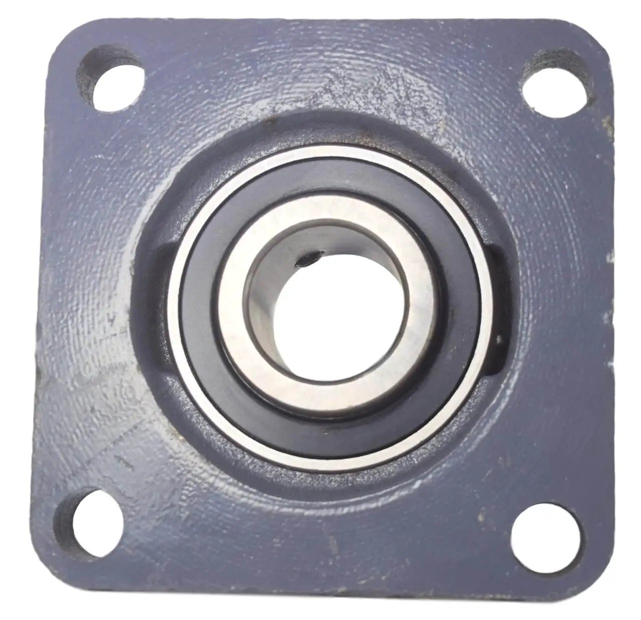 Front view of One And One Quarter Inch Bore Four Bolt Flange Bearing With Two Set Screws F4B SC 104 UCF207 20 Cast Iron Housing Grease Zerk