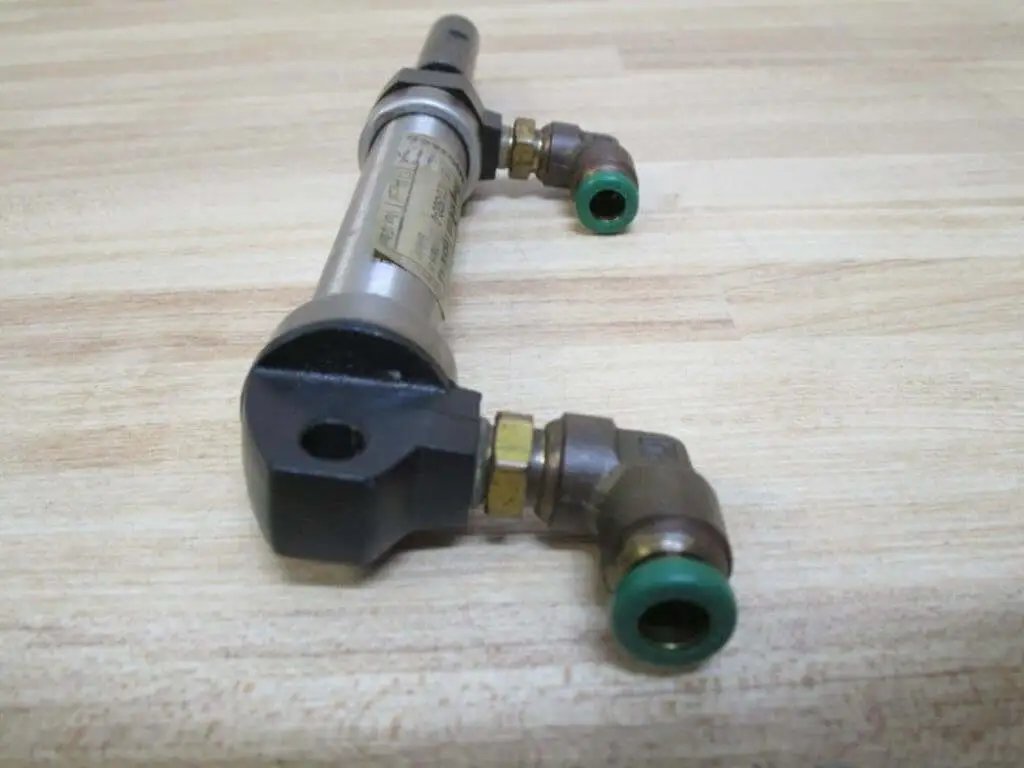 Front view of Industrial Hydraulic Cylinder 10mm Bore With Two And One Half Inches Stroke PN 13316050001 on a wooden surface.