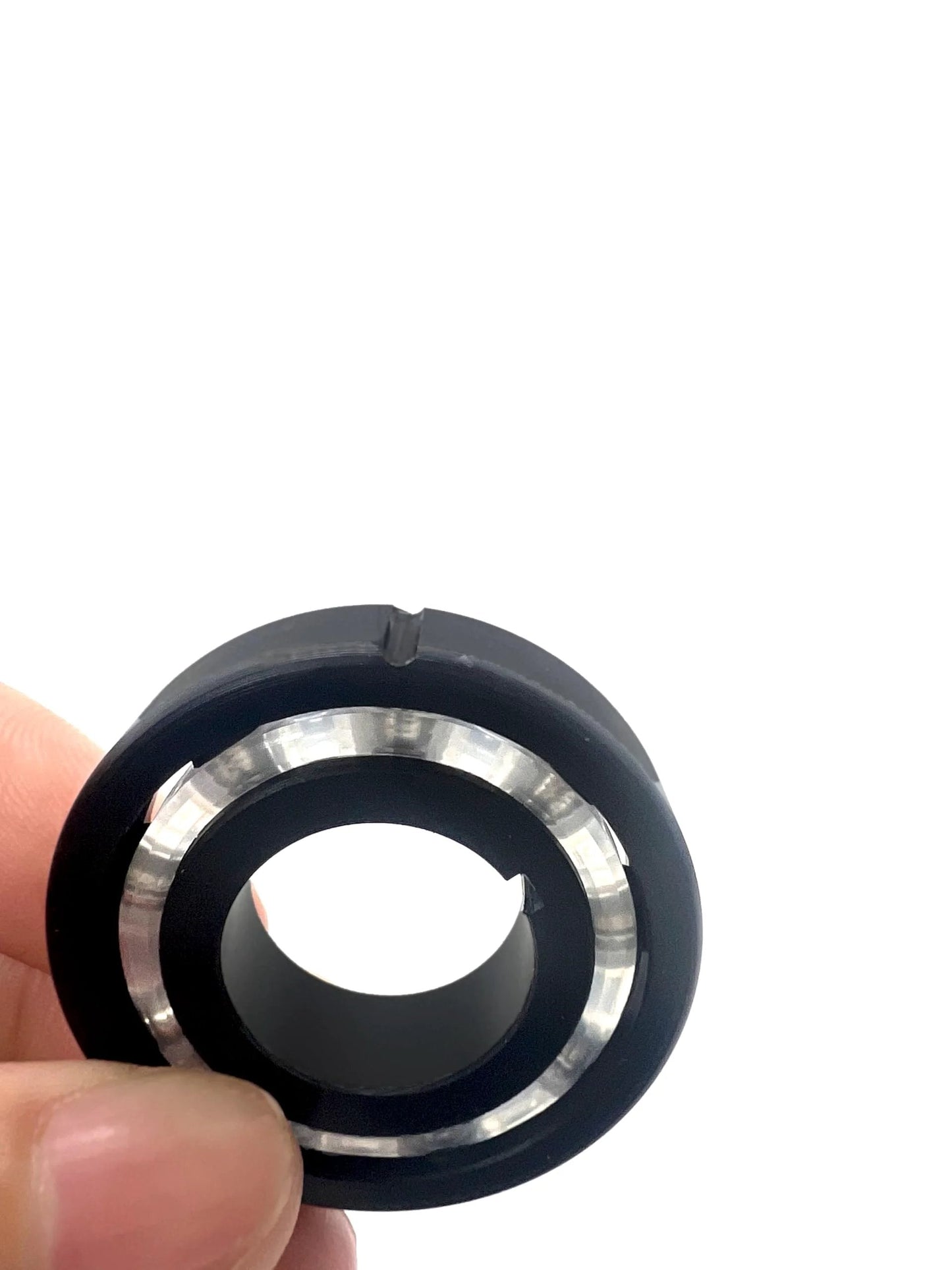 Close-up of a single black turbine bearing from AXV055P Turbine Bearing Replacement Parts 4 Pack for Pool Vacuum Cleaners.