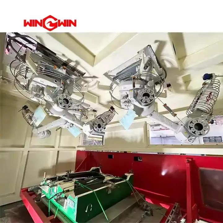 Industrial robotic arms inside a manufacturing facility for precision machining operations.