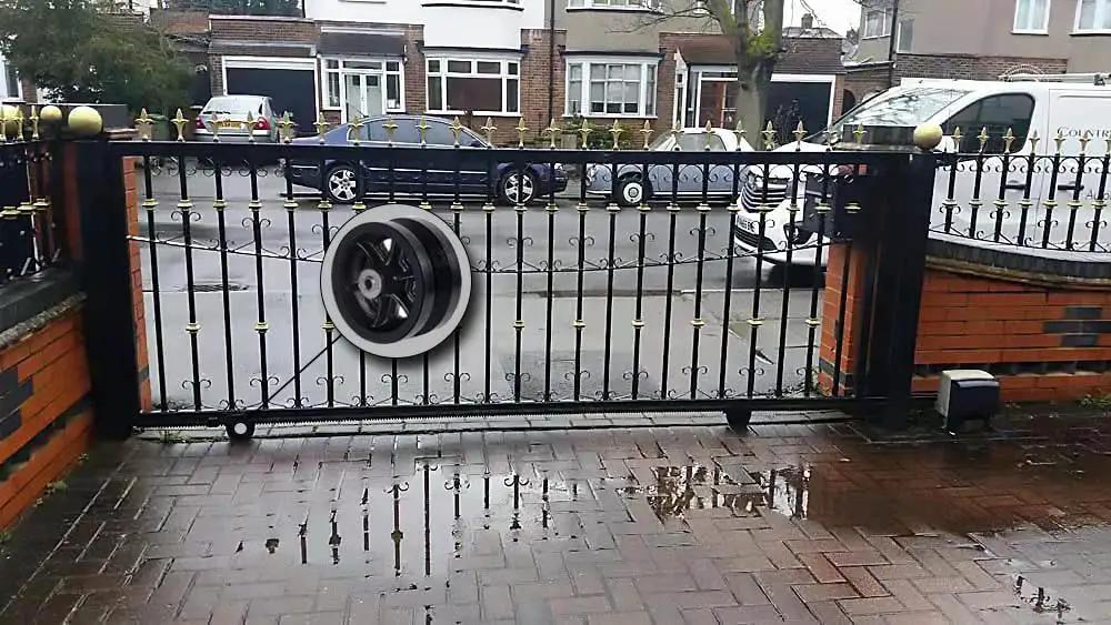 Sliding gate with 4 Inch By 1-1/2 Inch Cast Iron V Groove Caster Wheel With Straight Roller Bearing For Heavy Duty Machinery in use