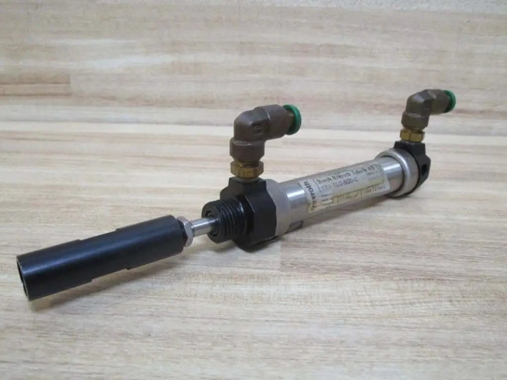 Industrial Hydraulic Cylinder 10mm Bore With Two And One Half Inches Stroke PN 13316050001 on wooden background