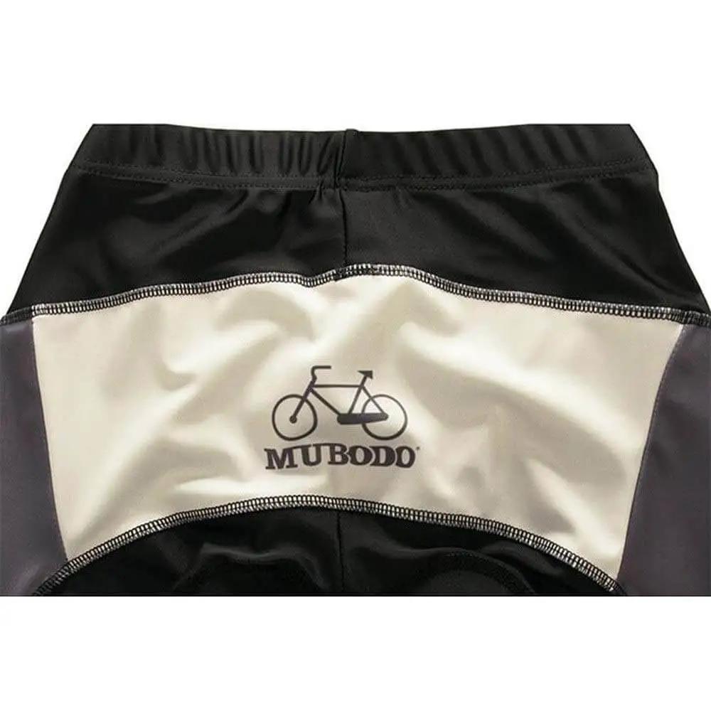 Close-up of Muboddo cycling shorts with logo and bicycle graphic, showing back detail in black and beige fabric.