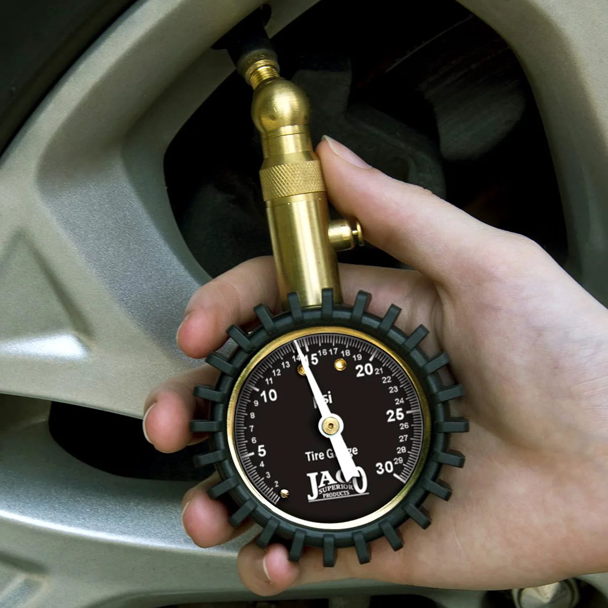 Low Pressure Tire Gauge For ATVs UTVs Dirt Bikes And Off Road Vehicles ANSI Accurate To 1.5 Percent No Battery Needed Built Tough With A Solid Feel Delivers Precise 30 PSI Readings For Tractors And Other Off Road Machines shown measuring tire pressure on a vehicle wheel.