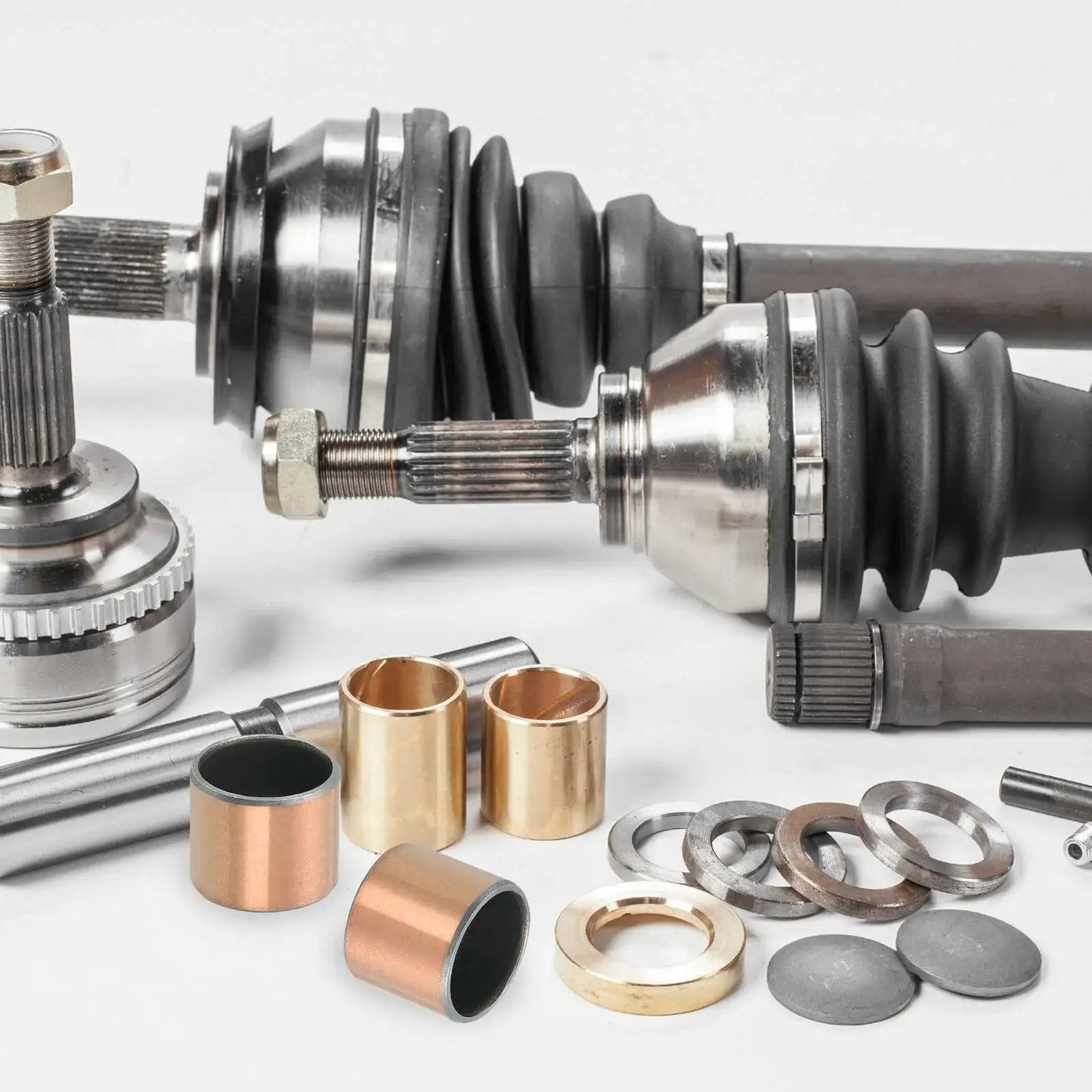 Three Pack Sleeve Bearings 1 in Bore, 1-1/8 in OD, bronze sintered layer on iron steel base, shown with machinery parts