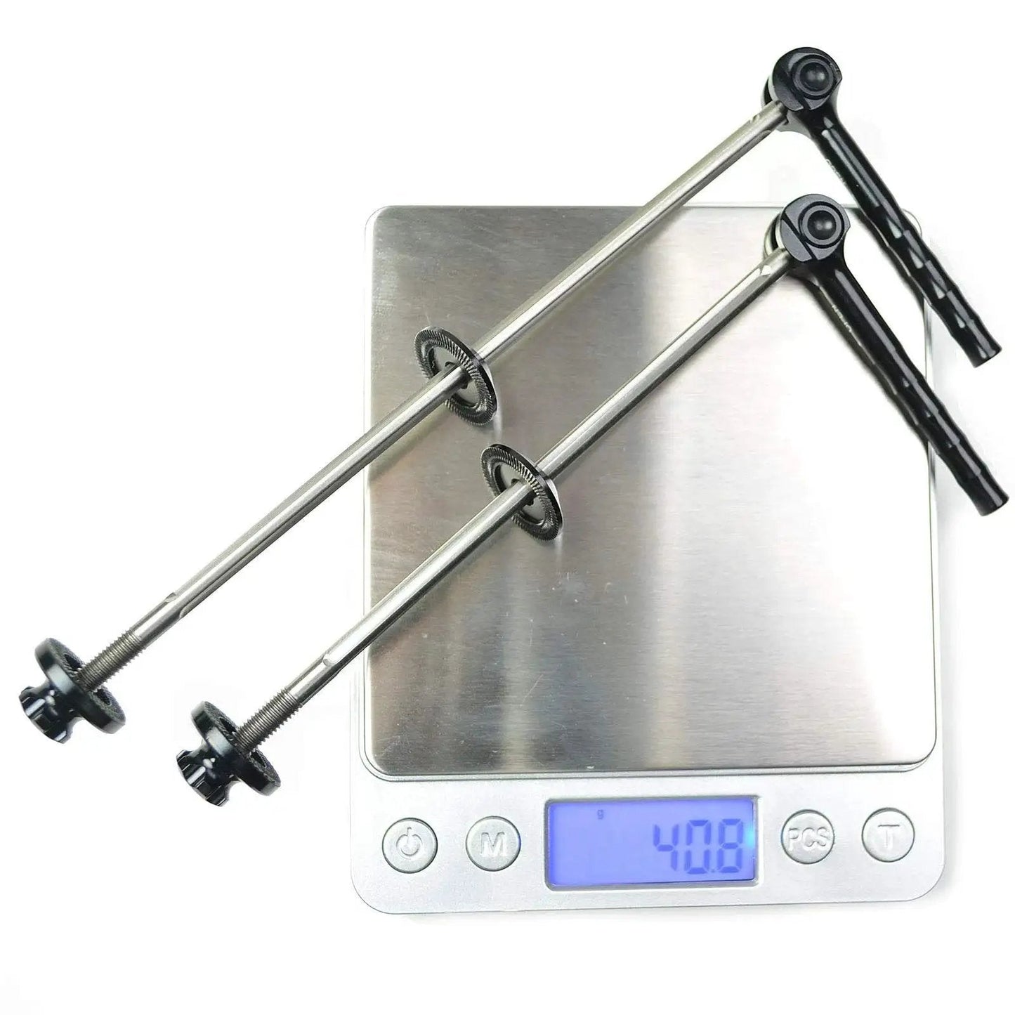 World's Lightest Quick Release Wheel Skewer Set in Red by OMNI, 40.8 Grams Per Set displayed on a digital scale