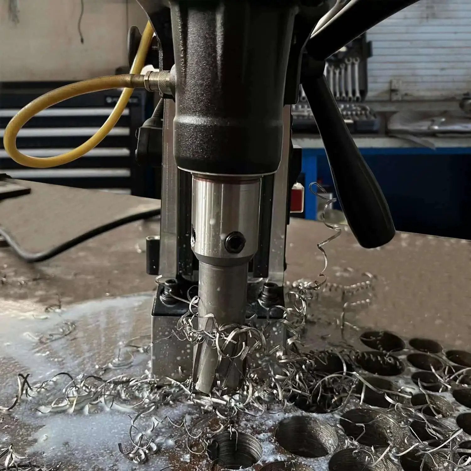 Magnetic Drill Press Kit 1100W Portable, 700 RPM No Load, drilling precise holes in steel with 2 Inch Depth of Cut, shavings visible