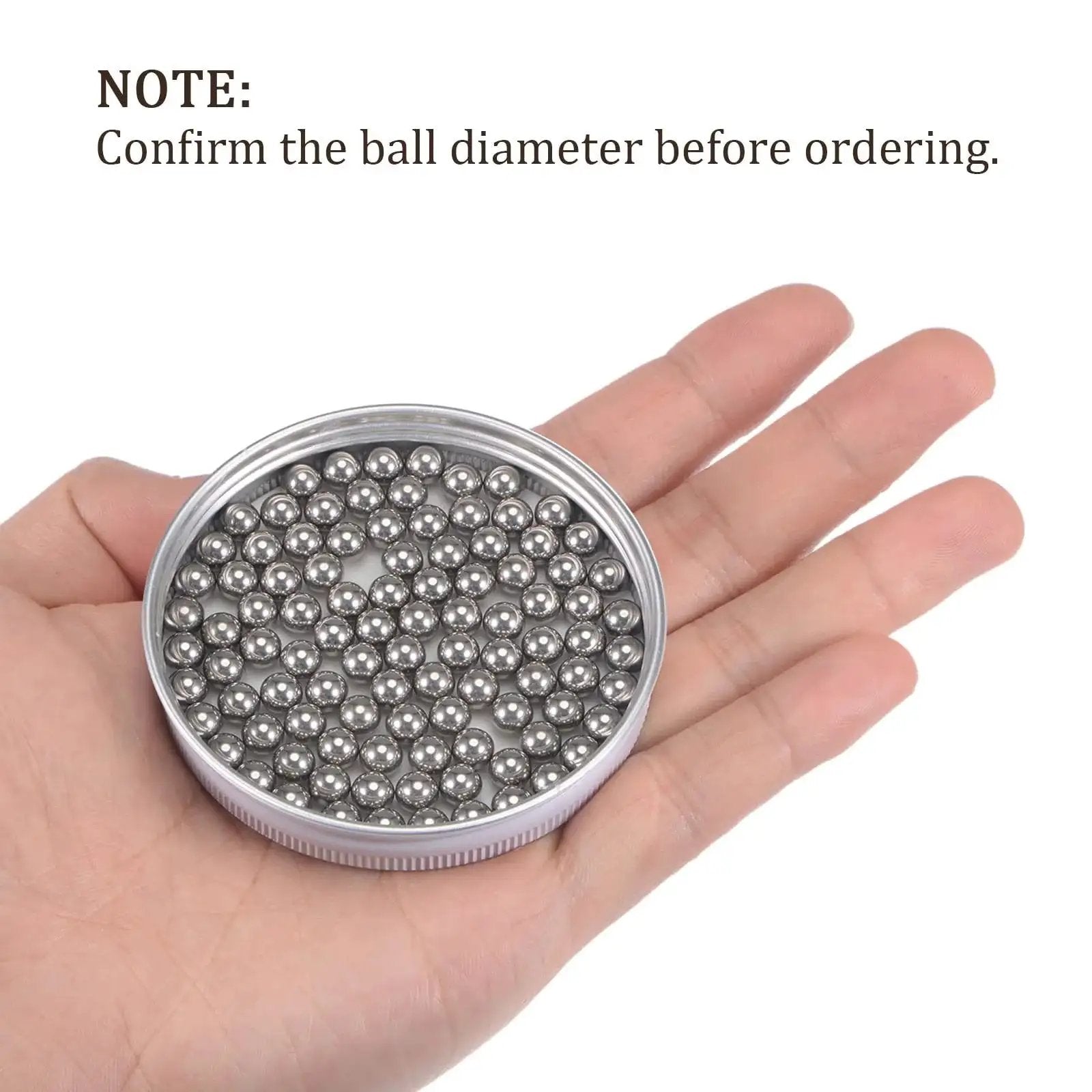 Hand holding Six Millimeter Precision Balls 304 Stainless Steel 20 Pack for bearings, turntables, drawers, mechanical projects, corrosion resistant.