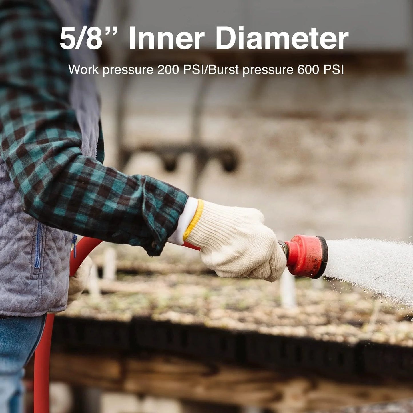 Person using Hot And Cold Rubber Garden Hose Five Eighth Inch Fifty Foot Long With Brass Fittings outdoors