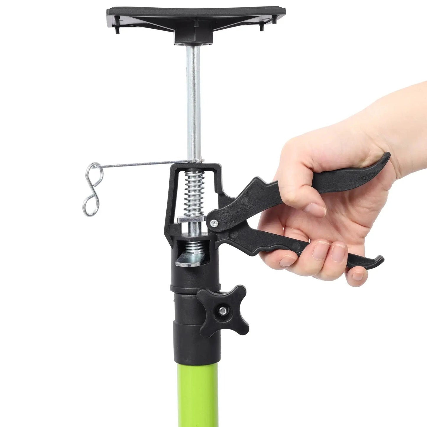 Close-up of a hand adjusting a Heavy Duty Adjustable Support Poles 45 To 114 With Non Slip Pads For Cabinets, showing handle and mechanism.