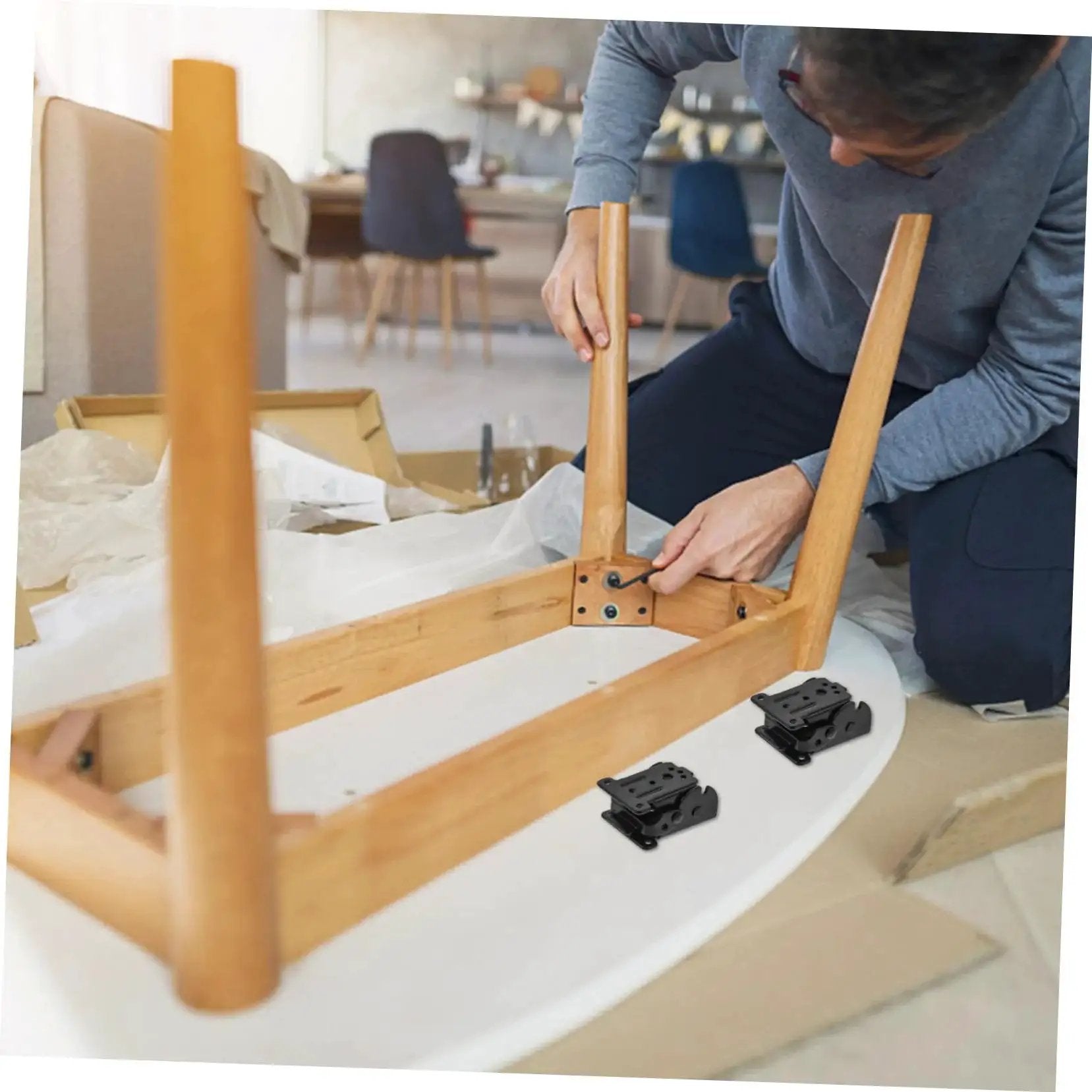 Person installing Four Pack Folding Rack And Table Hinge Set For Space Saving Easy Install High Load Capacity Durable Chair And Furniture Hinges