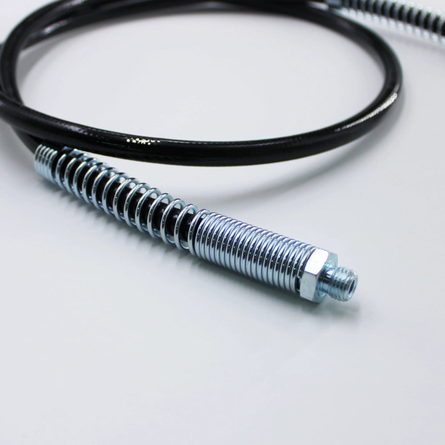 Close-up of Grease Gun Hose Replacement for Milwaukee M18 and M12 Grease Guns 48 Inch Long with tips, heavy-duty metal fitting.