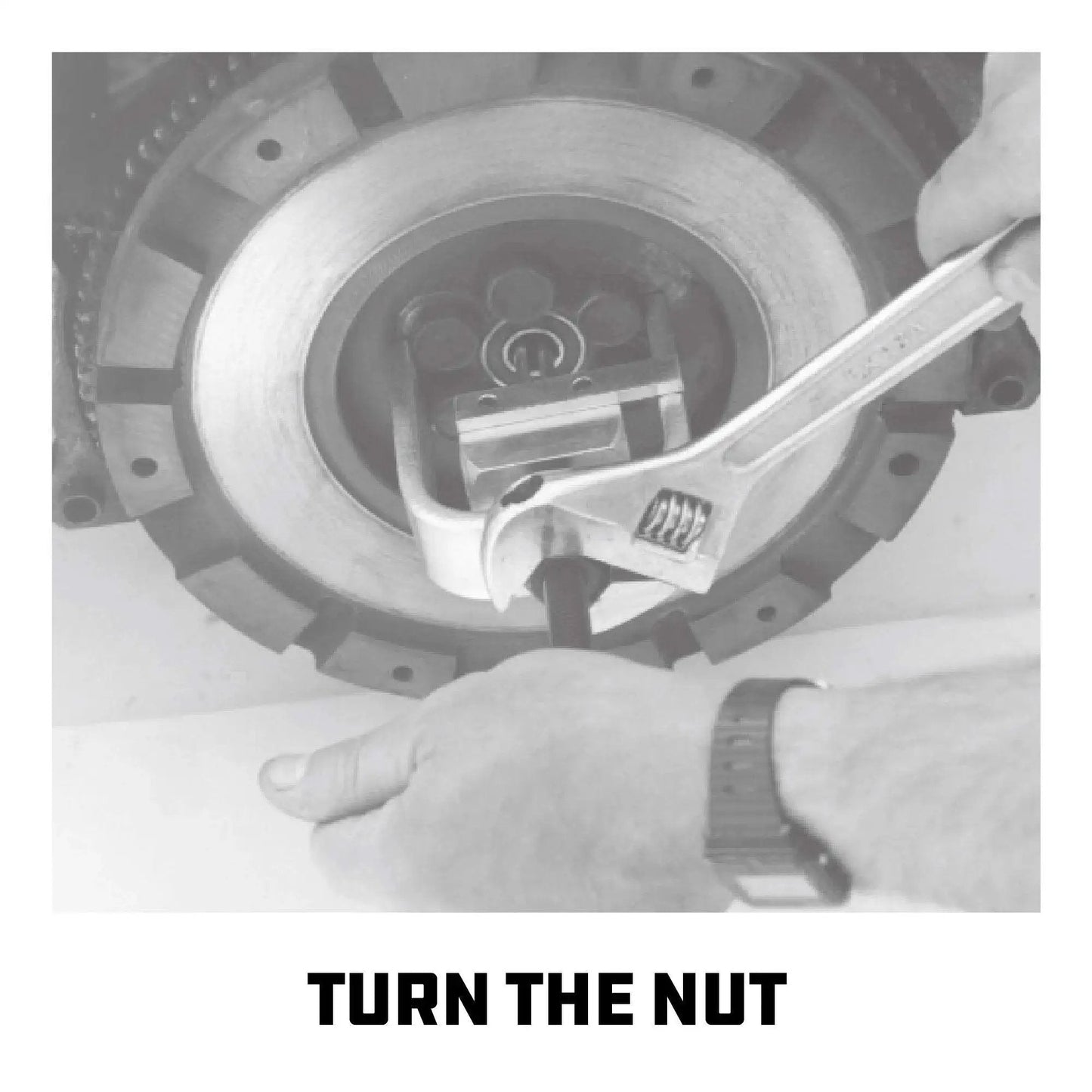 Mechanic using wrench on pilot bearing and bushing puller for flywheels and clutch replacement with deep reach fingers heavy duty removal tool