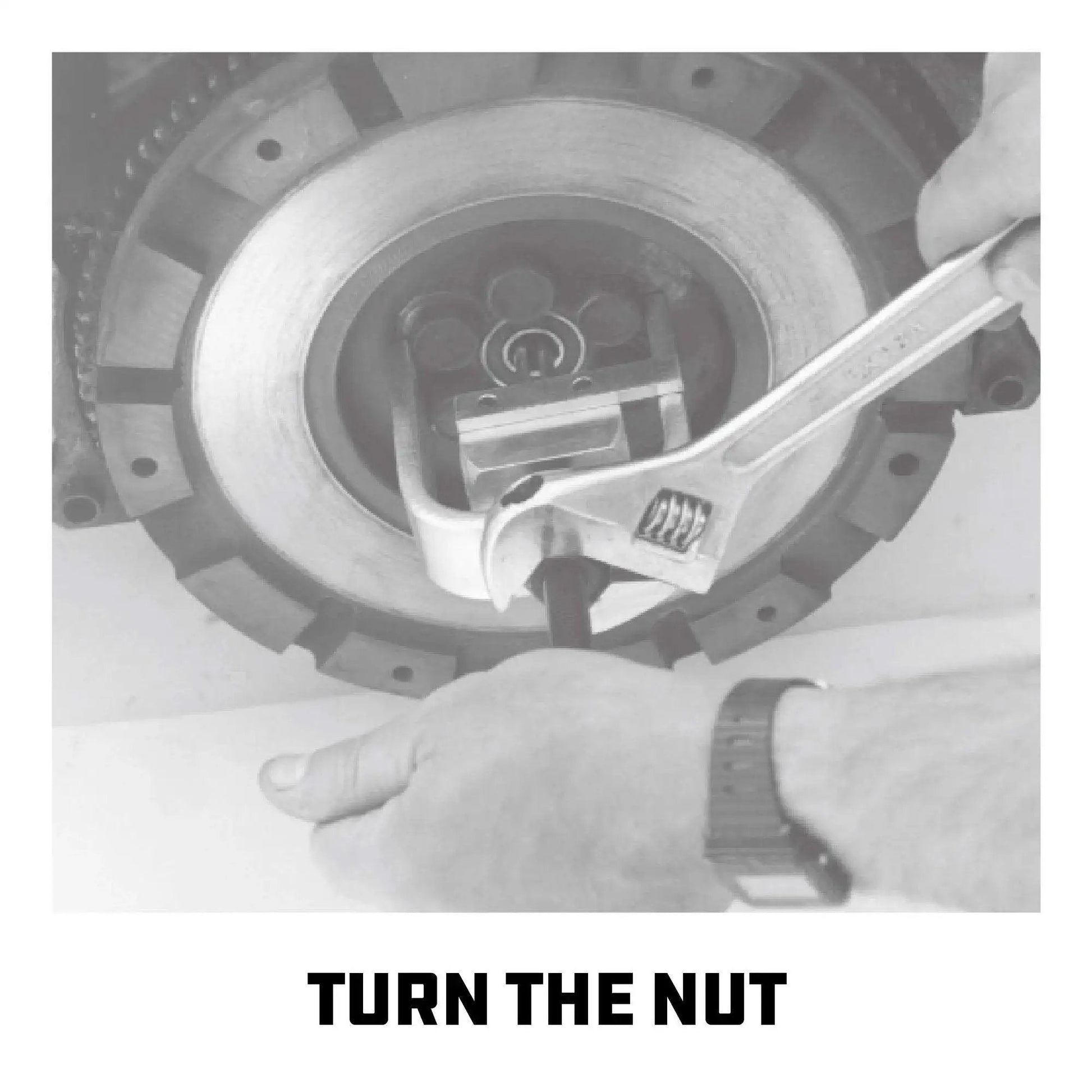 Mechanic using wrench on pilot bearing and bushing puller for flywheels and clutch replacement with deep reach fingers heavy duty removal tool