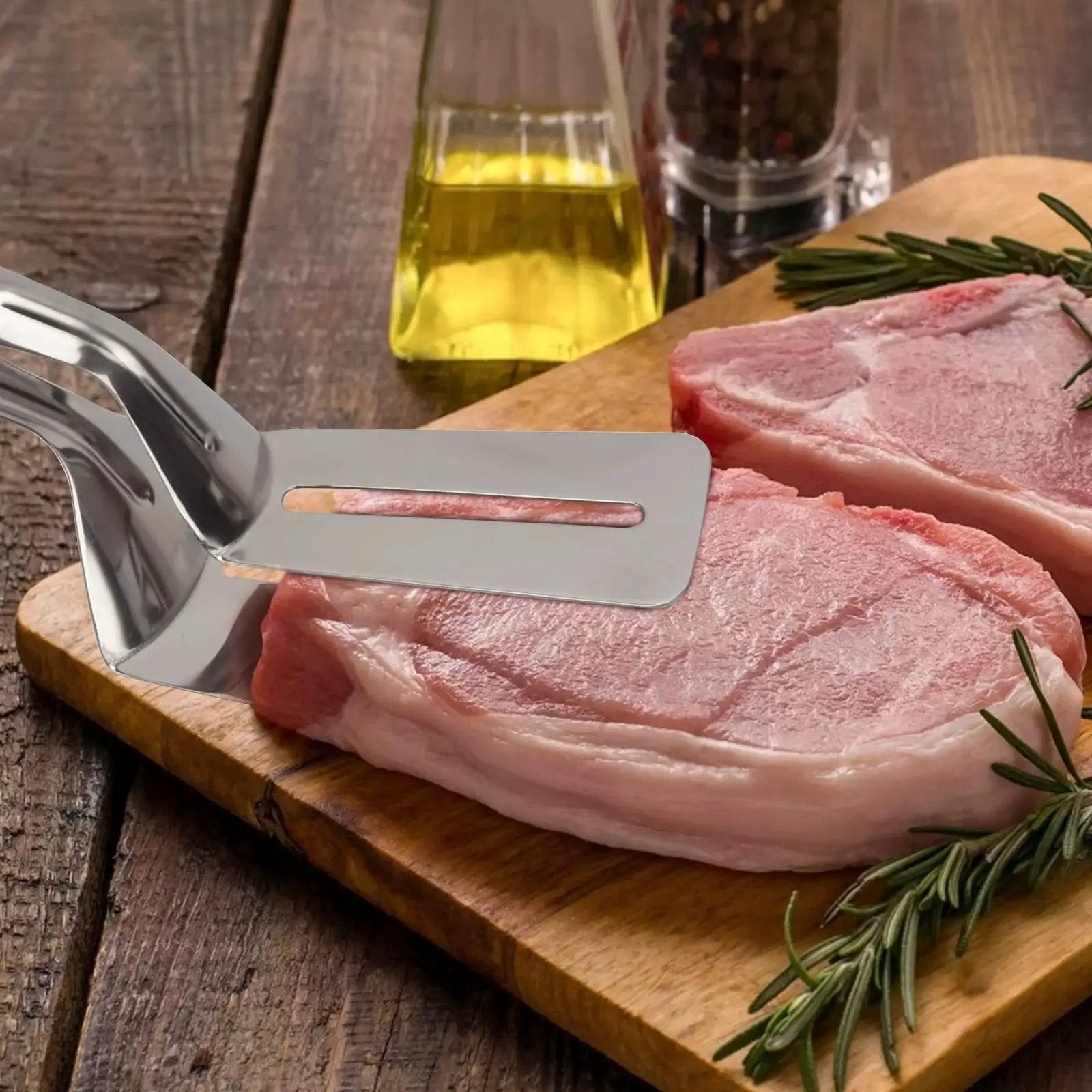 Multifunction 11 Inch Premium Stainless Steel Tongs 3 In 1 Gripper Flip And Scraper with raw meat on wooden board