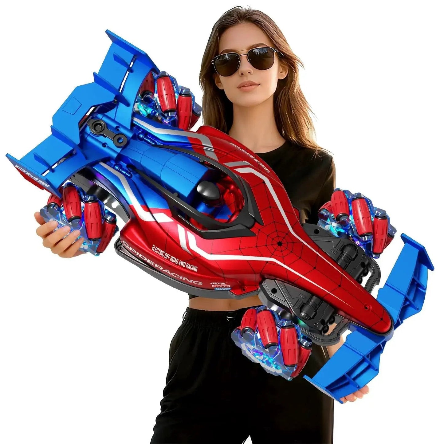 Two Point Four GHz Monster RC Truck With Lights And Music For Off Road Stunts One Twelfth Scale Remote Controlled Car held by woman.