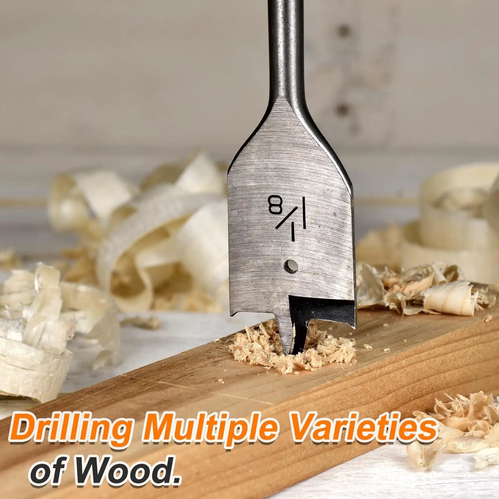 Three Piece Spade Drill Bit Set Three Quarter Inch Paddle Flat Bits For Woodworking with wood shavings in background