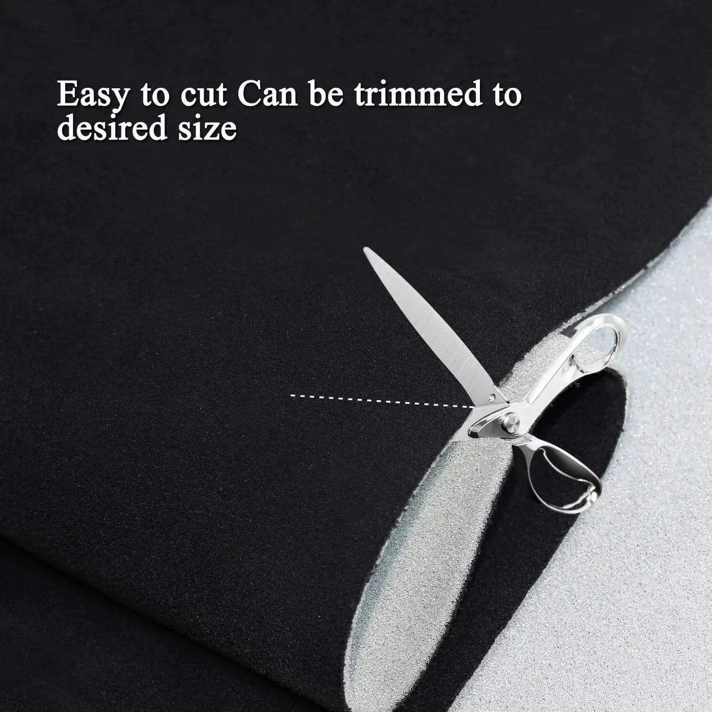 Close-up of Suede Headliner Fabric With Foam Backing For Car Interior Black 96x60 being cut with scissors.