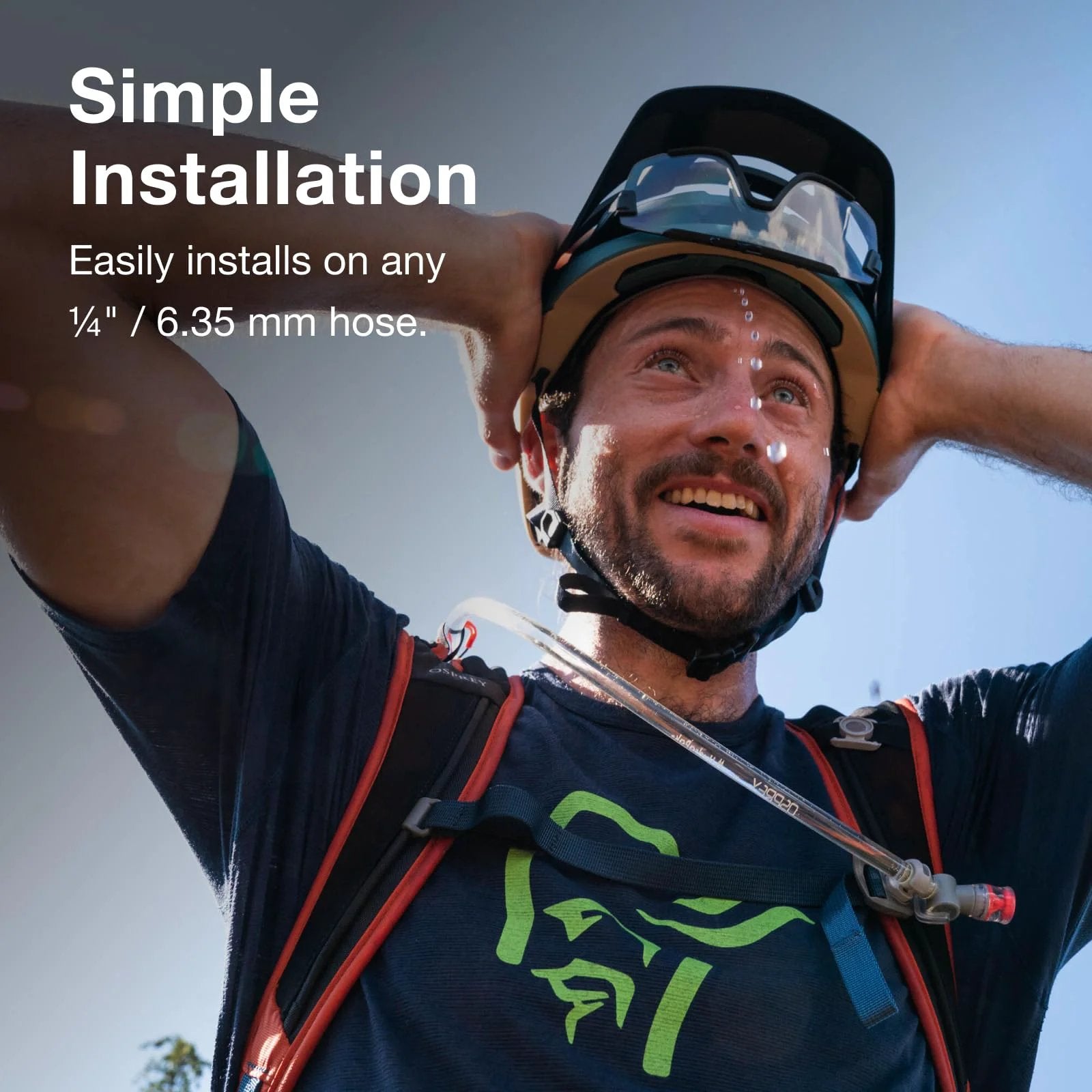 Man wearing hydration backpack using Hydraulics Quick Connection Kit For Water Reservoir System Quarter Inch Hose Fittings