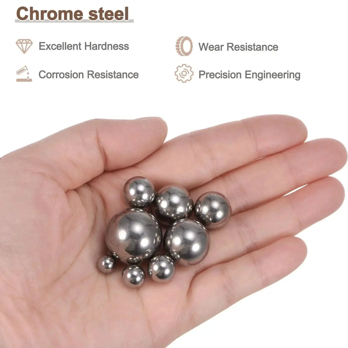 Hand holding Chrome Steel Bearing Balls Set Of 24 In Eight Sizes From One Quarter Inch To Three Quarters Inch For Precision Bearings.