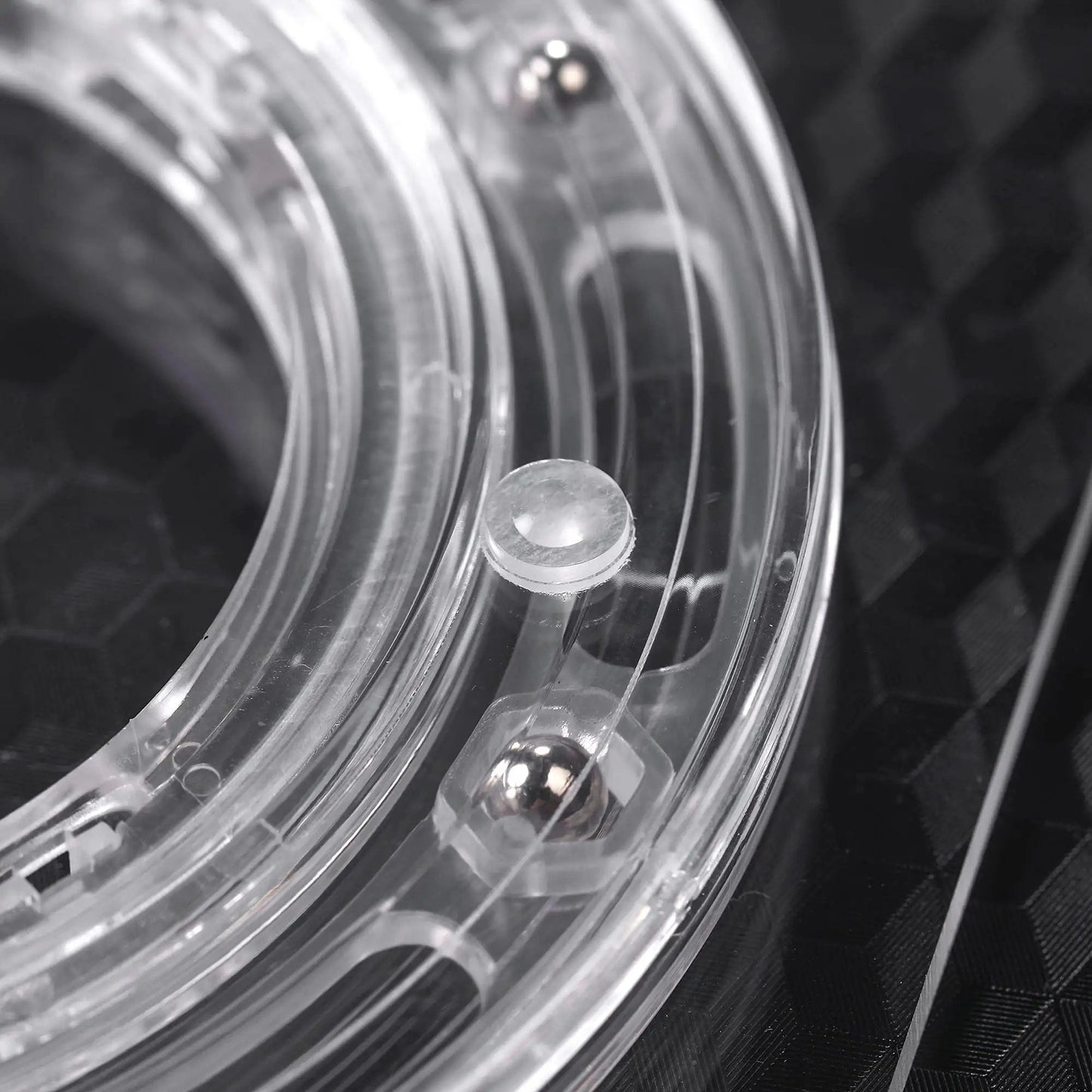 Close-up of the clear acrylic bearing base of 7 Inch Square Cookie Decorating Turntable for faster smoother icing