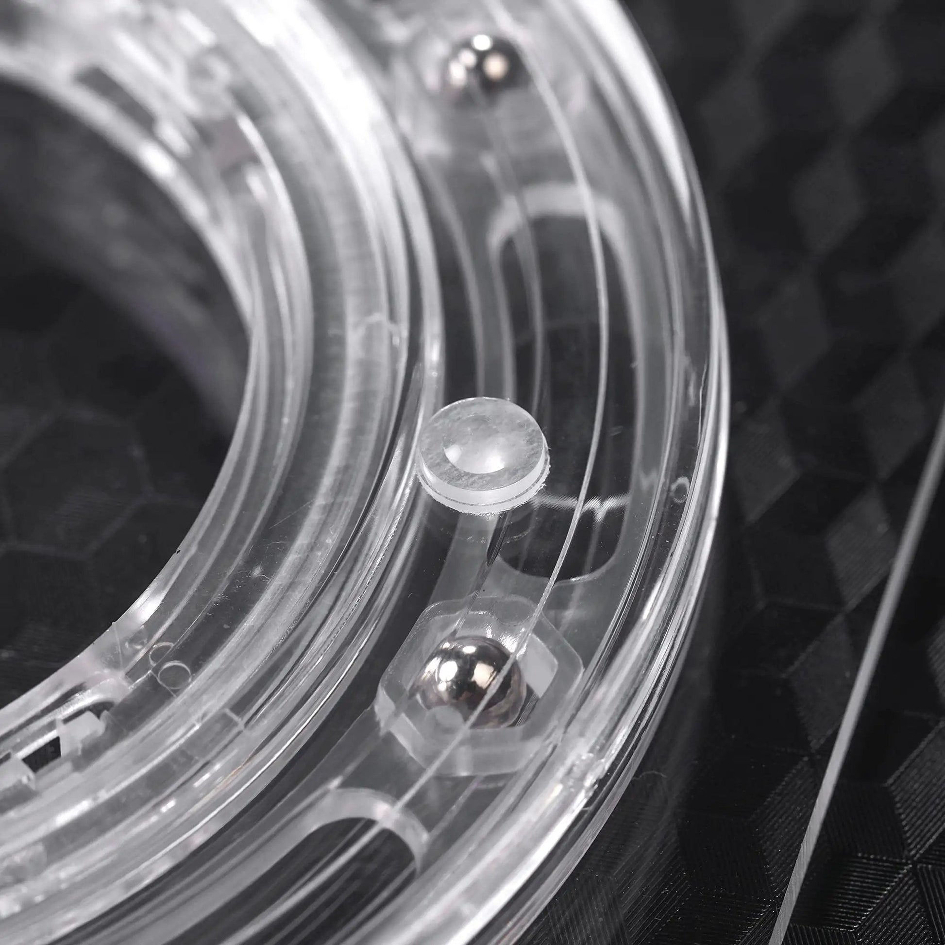 Close-up of the clear acrylic bearing base of 7 Inch Square Cookie Decorating Turntable for faster smoother icing