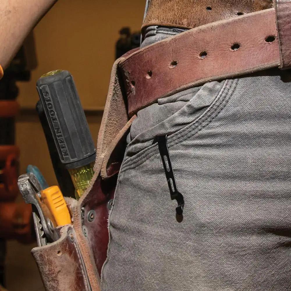Electrician with belt showing Folding Pocket Knife For Electricians With Bearing Assist Flipper And Frame Lock Black Handle clipped in pocket.