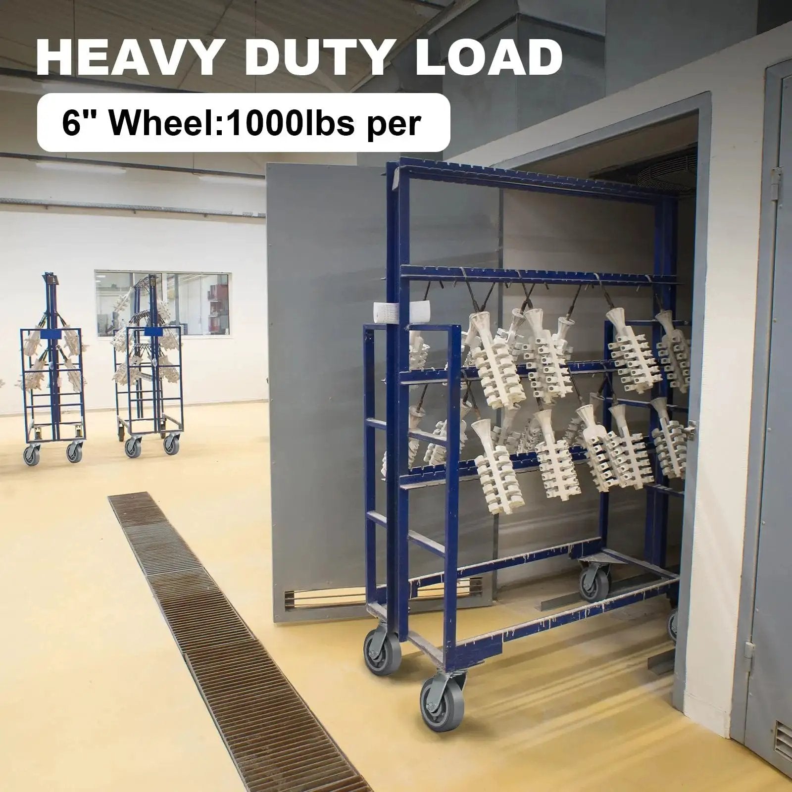 6 inch heavy duty caster wheels on blue cart in industrial setting, 1000 lbs capacity per wheel, Heavy Duty 6 Inch By 2 Inch Rubber Tread Caster Wheels Set Of 4 With 1/2 Inch Bore For Carts And Hotels Quiet Indoor Use 3/4 Inch Roller Bearing Load Up To 600 Lbs Per Wheel Ideal For Quiet Indoor Mobility On Carts Reducing Noise And Vibration.