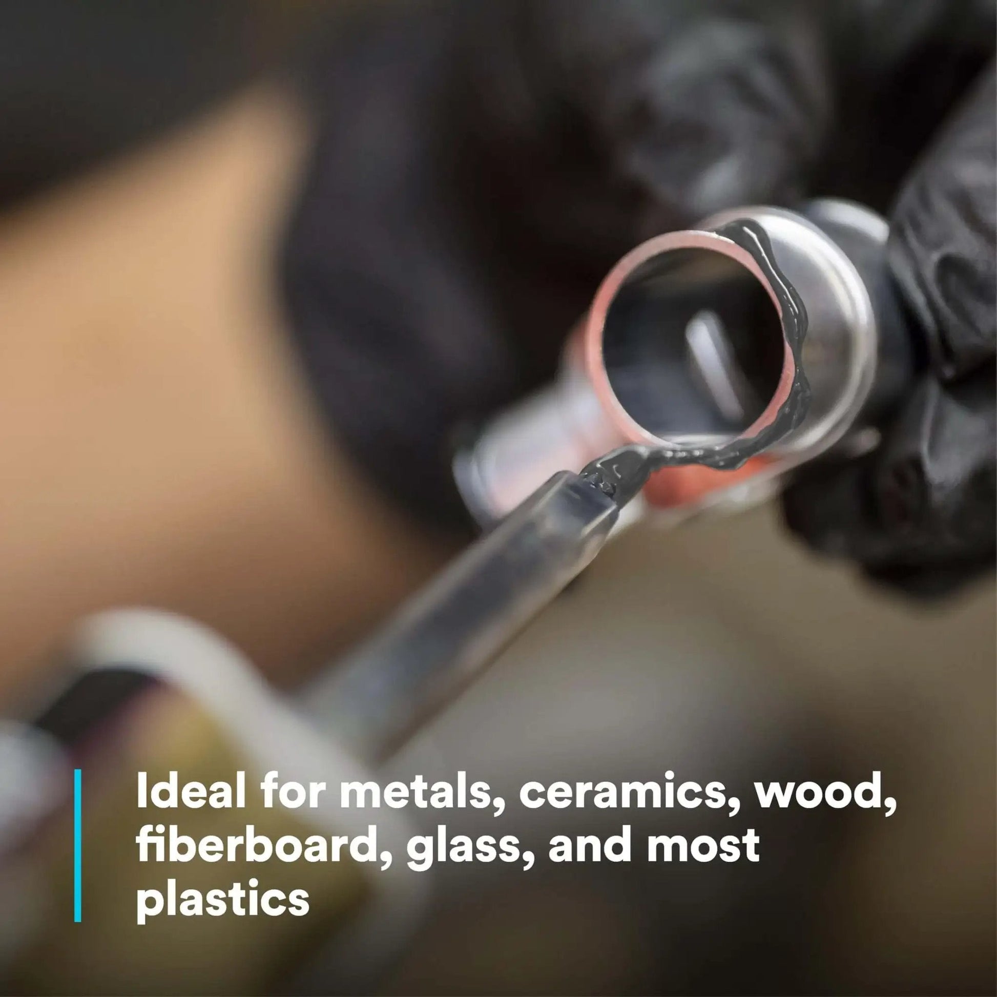 Applying DP190 Gray Epoxy Adhesive Duo-Pak 48.5 mL on metal for high shear and peel strength bonding.