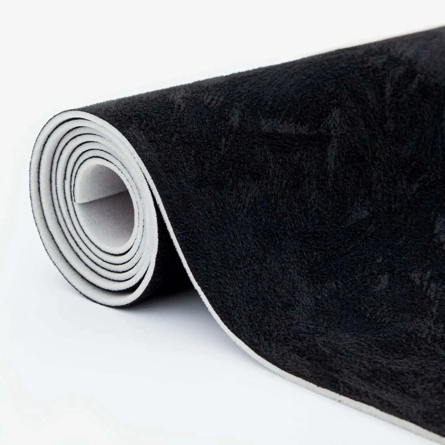 Rolled black suede auto headliner fabric 98 by 60 inches with foam backing tube pack, showing textured surface and edge.