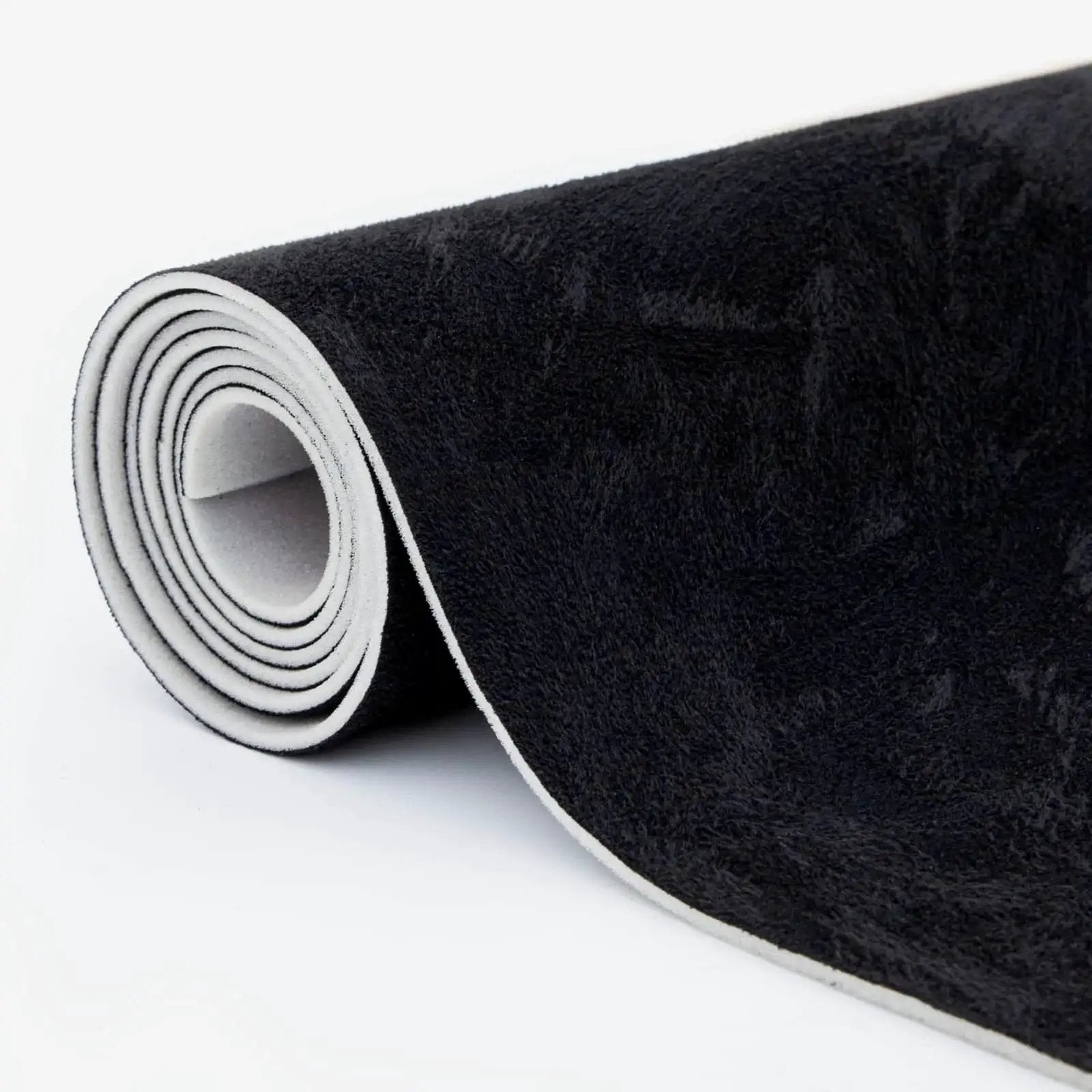 Rolled black suede auto headliner fabric 98 by 60 inches with foam backing tube pack, showing textured surface and edge.