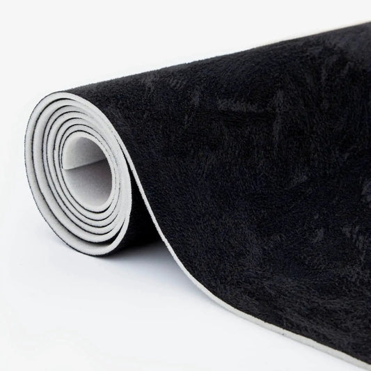 Rolled black suede auto headliner fabric 98 by 60 inches with foam backing tube pack, showing textured surface and edge.