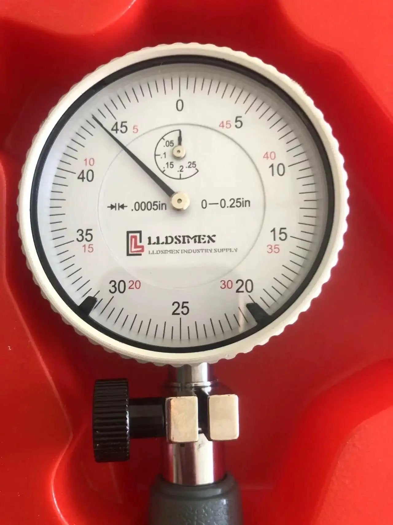 Close-up of Dial Bore Gage Set 0.7 To 1.5 Inches With Carbide Tipped Contact Points And 0.0005 Inch Graduation, in red case.