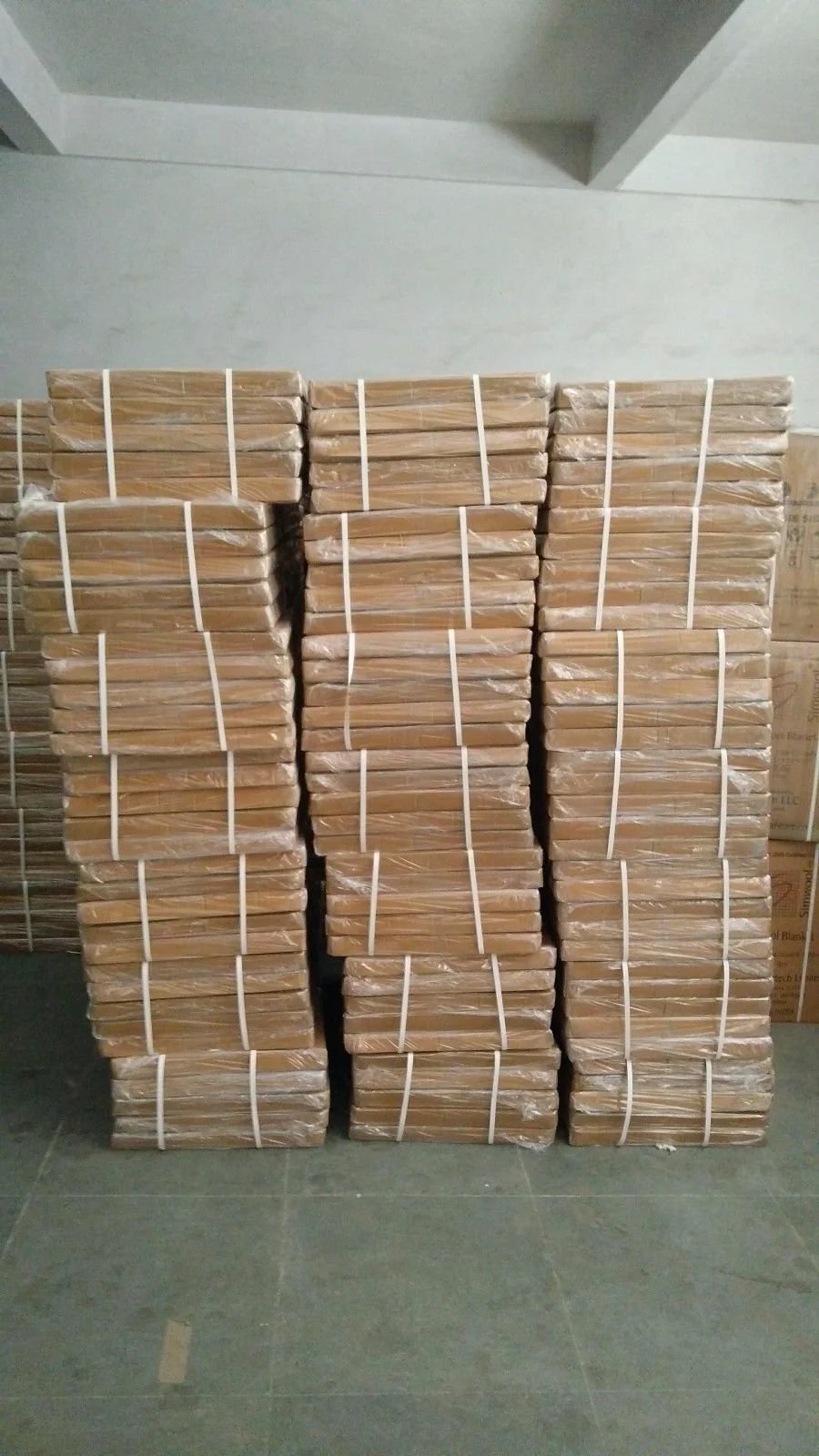 Stack of packaged Ceramic Fiber Insulation Board 2300F 1 Inch By 18 Inch By 24 Inch for wood stoves and fireplaces.