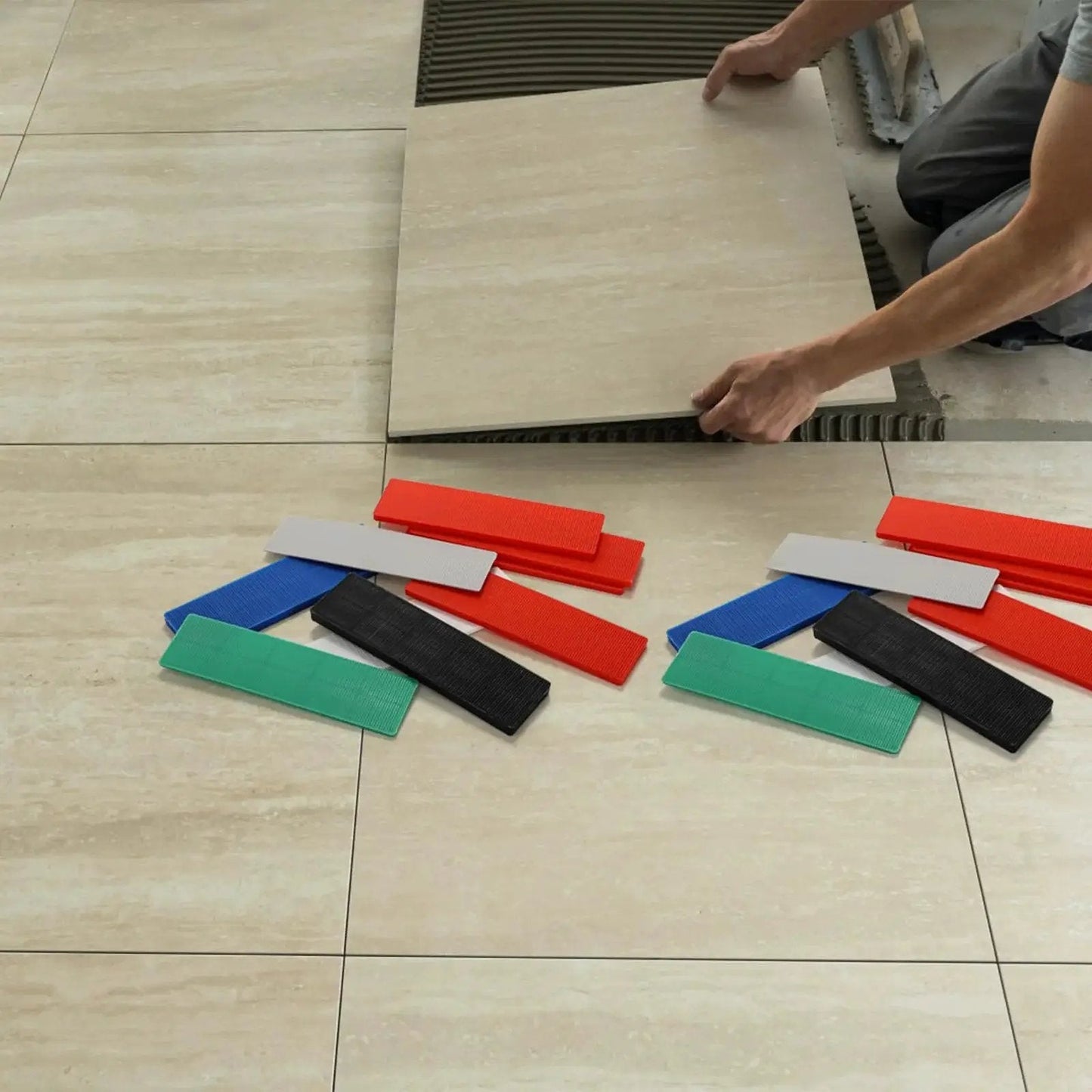 Bulk 300 Piece Plastic Flat Shim Set For Leveling And Tile Installation with color-coded shims on tiled floor