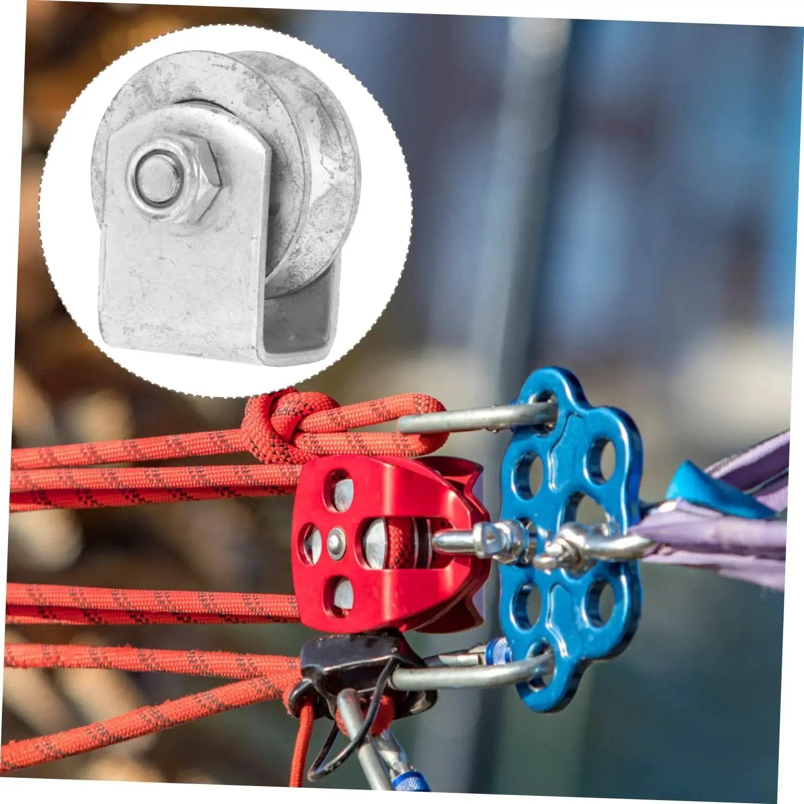 Close-up of a cast iron V-groove wheel heavy duty steel roller for sliding gates and industrial pulley systems with colorful ropes attached.