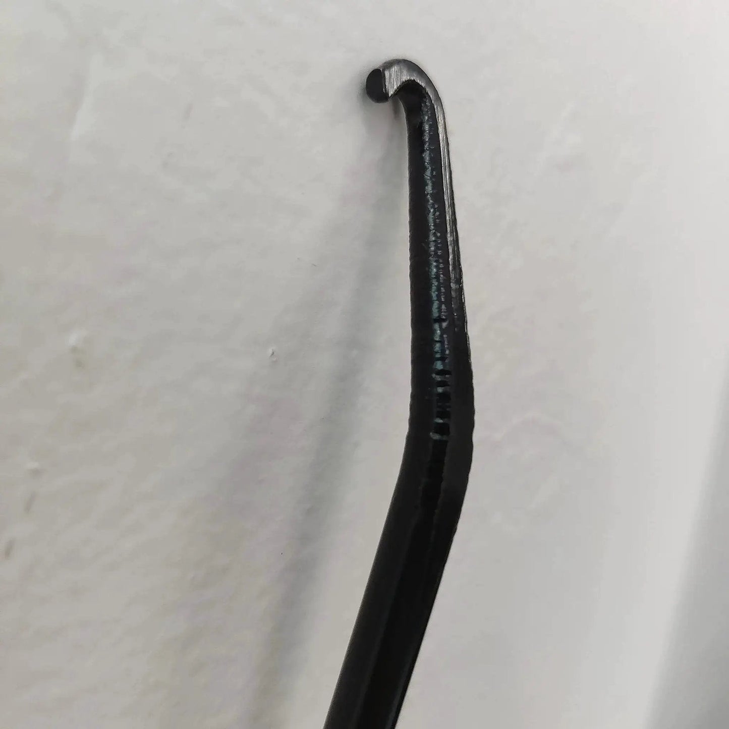 Close-up of a metal Exhaust Spring Hook T Shaped Handle For Motorcycle Rubber Coated Set Of 2, showing the hook's tip.
