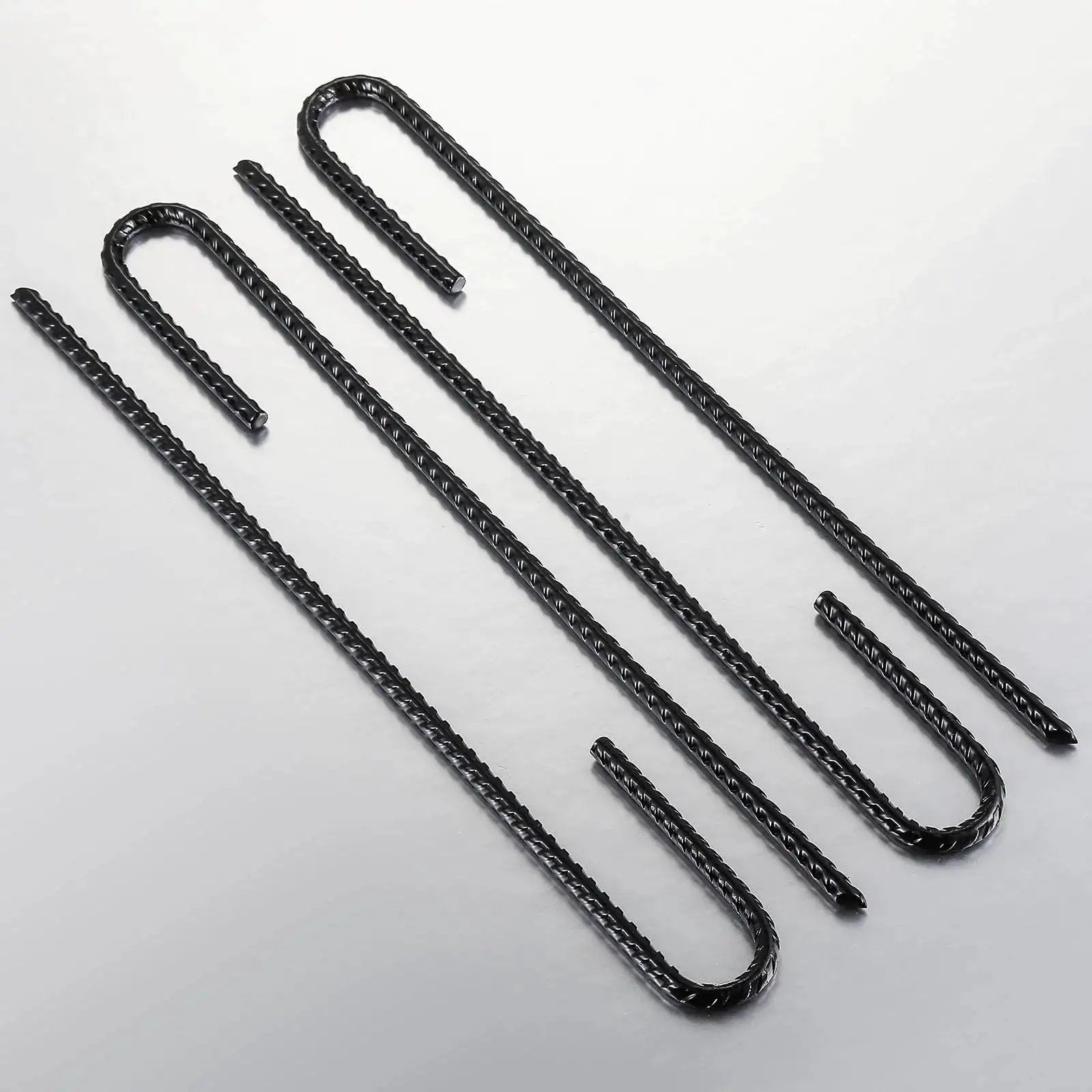 Extra Heavy Duty UJ Hook Rebar Ground Anchors Twelve Inch Long By One Quarter Inch Diameter Rust Proof Coated Steel For Garden Tent And Trampoline Fifty Pieces J Hook For Outdoor Use To Secure Tents Canopies Play Equipment In Wind, arranged in a row, visible from above