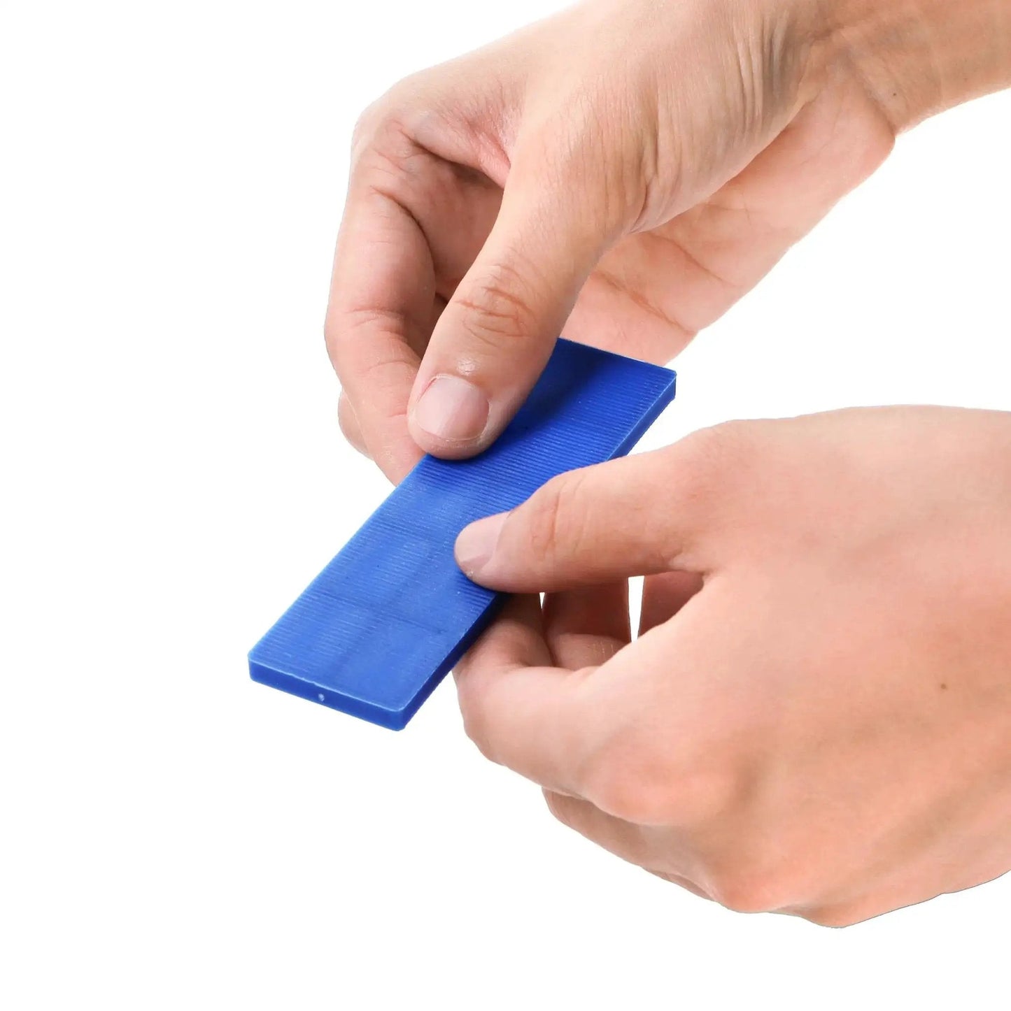 Person holding blue shim from Bulk 300 Piece Plastic Flat Shim Set For Leveling And Tile Installation Color Coded By Thickness From 1mm To 6mm With Grey Green White Red Blue Black Shims In 4 Inch Length And 1.1 Inch Width For Easy DIY Home Improvement