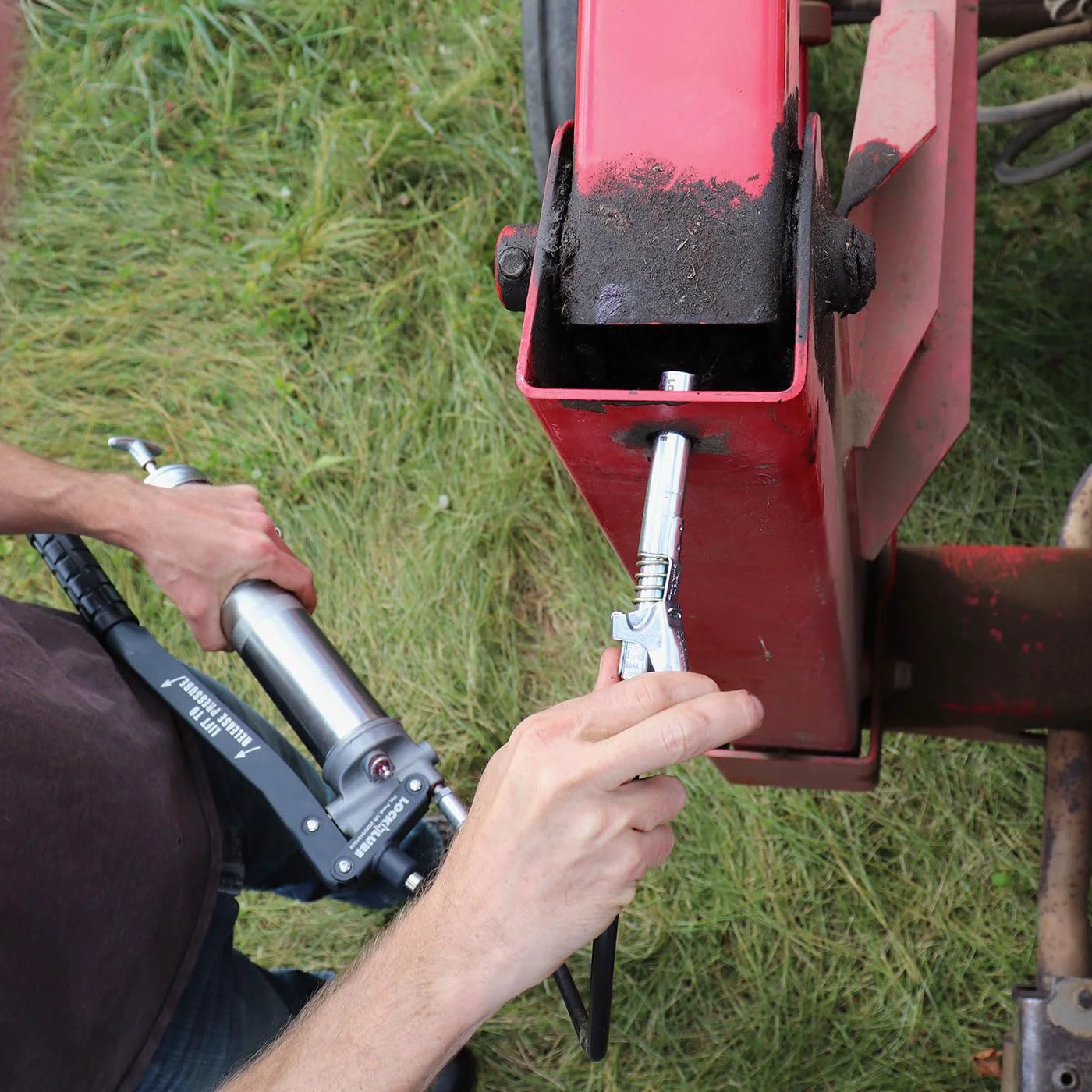 Extra Reach XL Grease Gun Coupler With Universal Fit Locking Hands Free Design For Recessed Fittings High Pressure Up To 10,000 PSI Leak Proof Quick Connect Durable Grease Fittings Tool For Pro And DIY in use on farm equipment