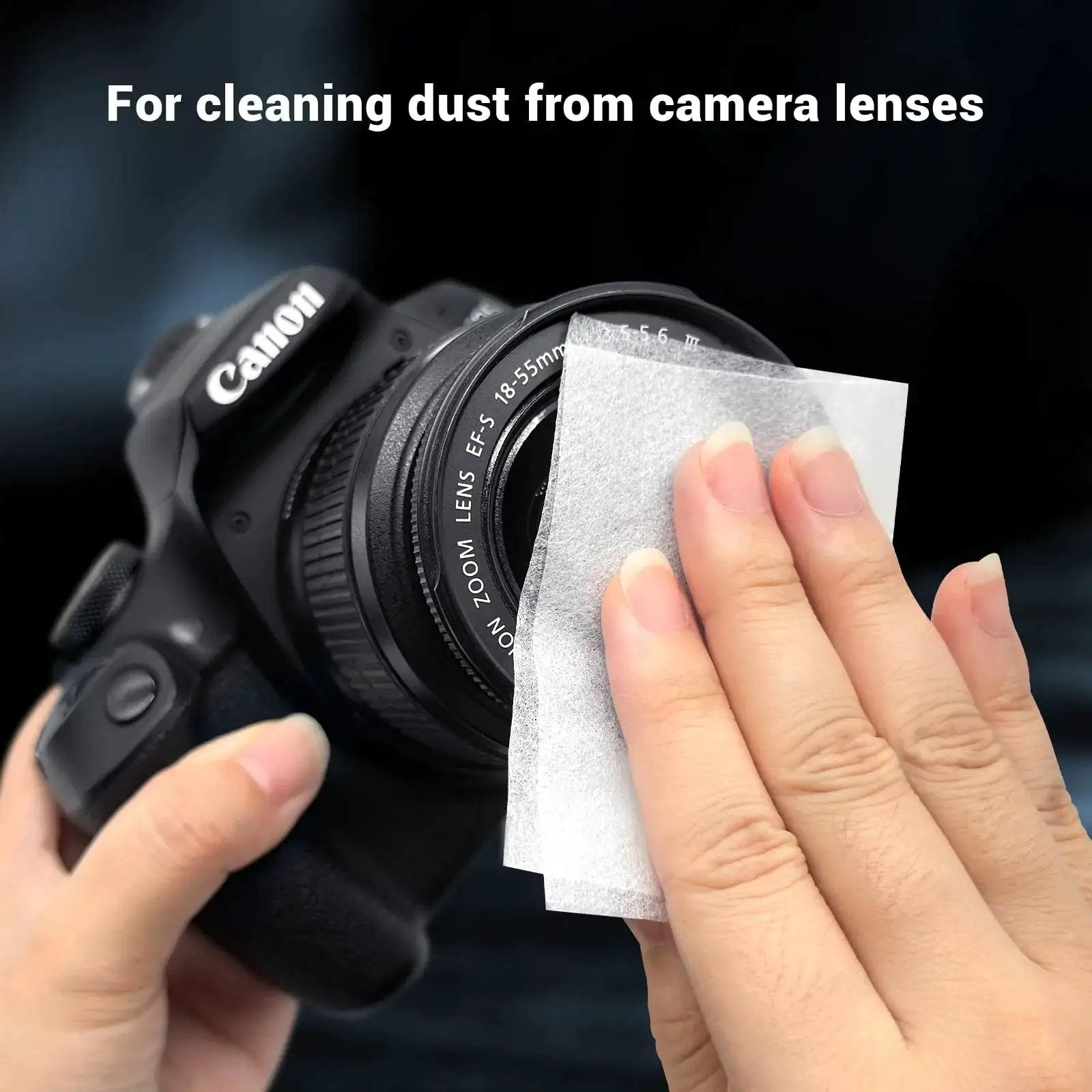 Hand using 700 Sheets Lens Cleaning Tissue Paper for Microscopes and Camera Lenses on DSLR camera lens