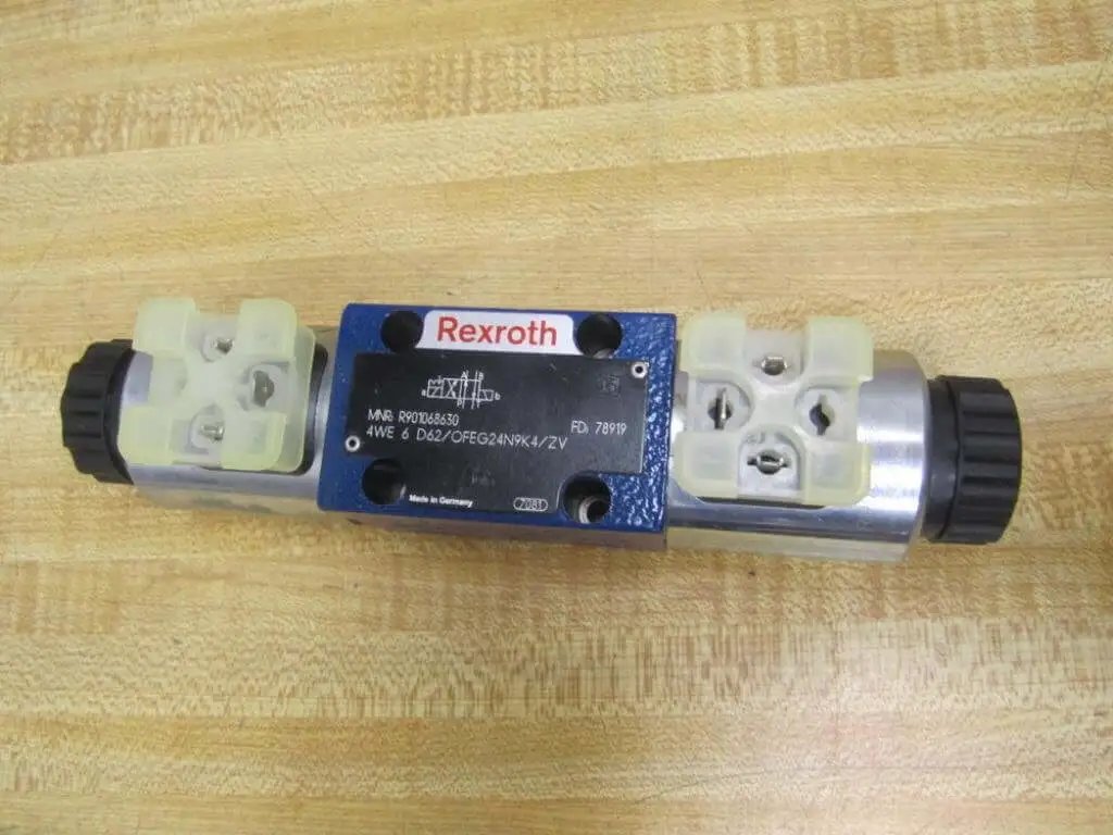 4WE 6 D62/OFEG24N9K4/ZV Directional Solenoid Spool Valve R901068630, top view, showing connectors and housing, used for industrial machines.