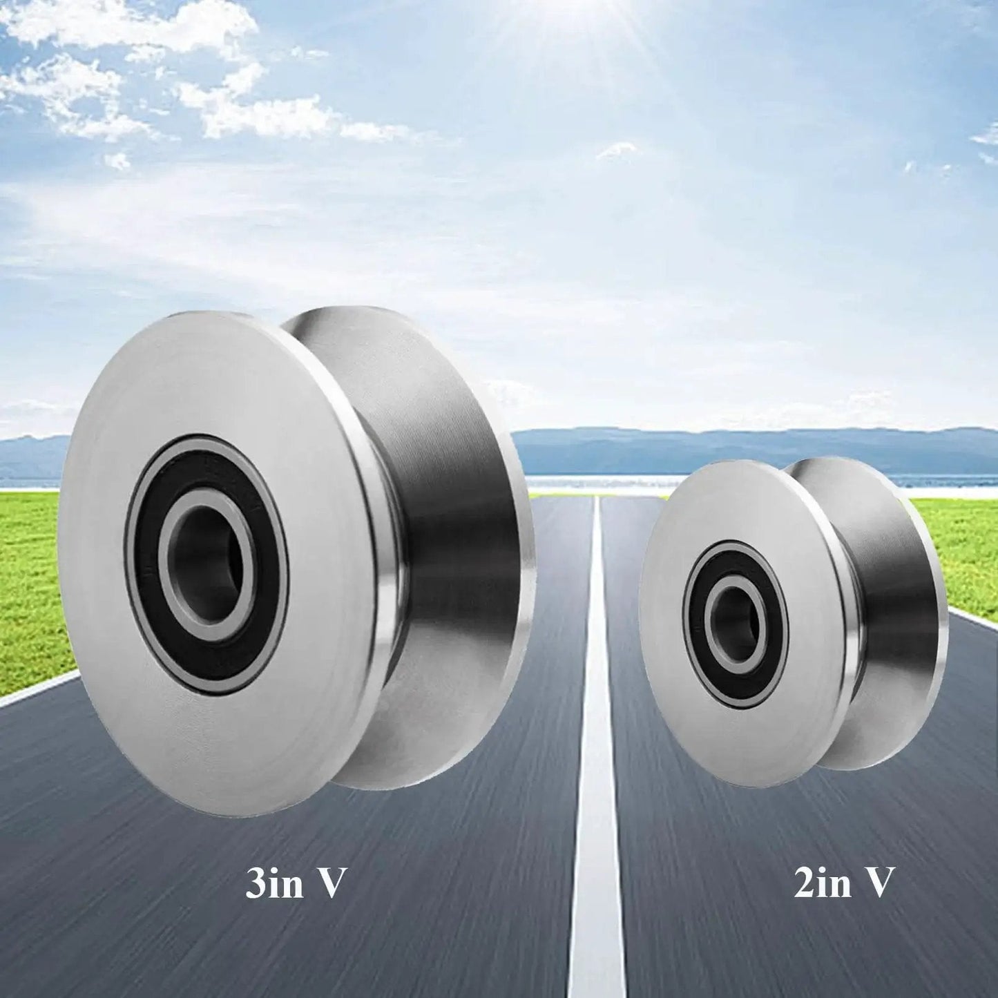 Two sizes of heavy duty stainless steel V groove gate rollers with bearings for smooth sliding barn door track, displayed on a road.