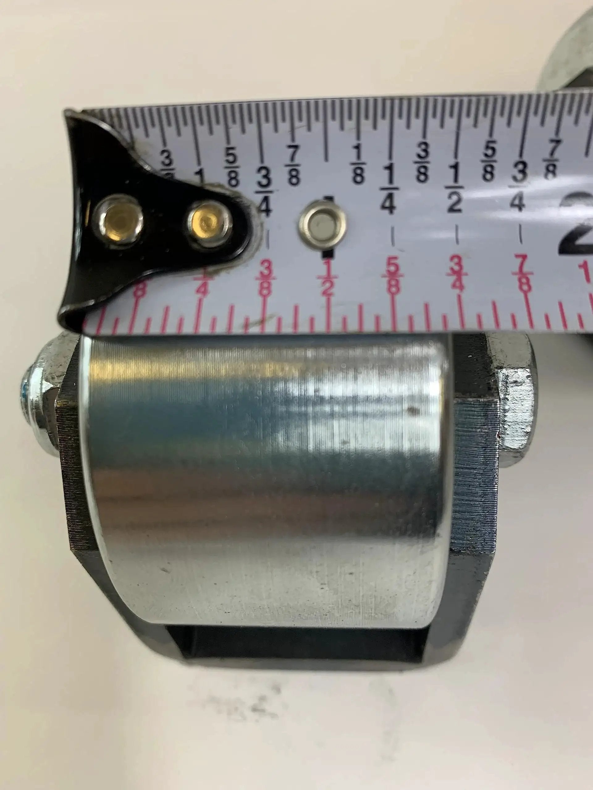 Close-up of solid steel roller from Set Of 2 Weld On Trailer Tail Drag Casters With Solid Steel Rollers And Greasable Axle 1.5 Inch Wide