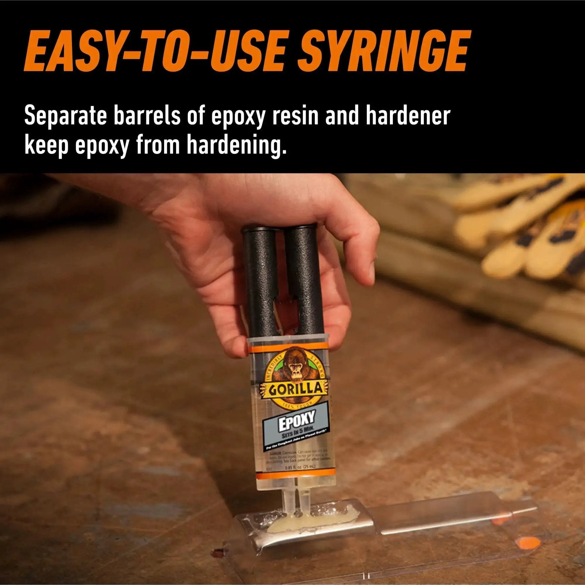 Hand using Clear 2 Part Epoxy Syringe, 0.85 Oz, 5 Minute Fast Set, Strong Bond to apply adhesive on metal surface.