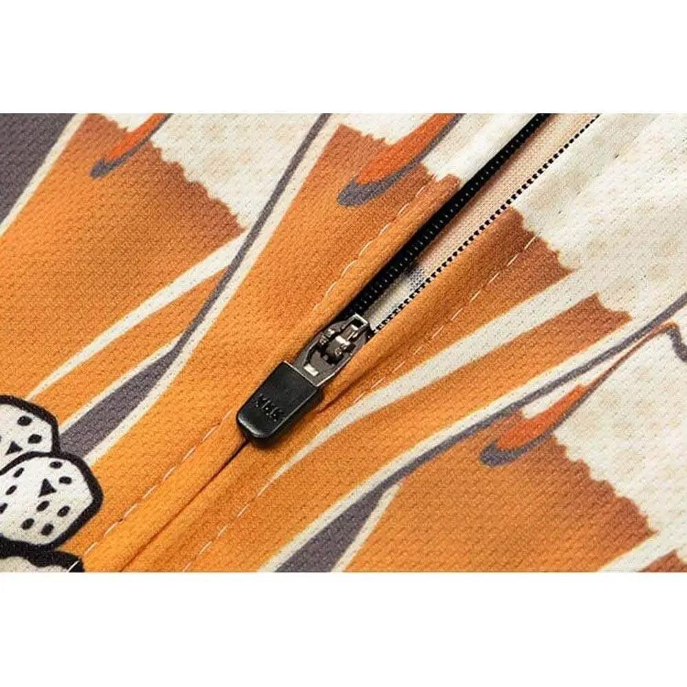 Close-up of orange fabric with zipper and abstract pattern